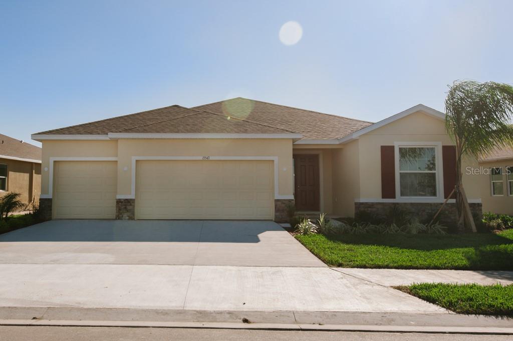 This 4 bedroom, 3 bathroom, 3 car garage home on a water front lot and is located in the gated community of Del Tierra.  The great room plan has a ceiling fan and sliding glass door to the covered, screened lanai.  The kitchen has granite counter tops, wood cabinets and a walk in pantry.  The primary bedroom has two walk in closets and a ceiling fan.  The primary bathroom has dual sinks, a shower, and separate tub. The other bedrooms have ceiling fans.  Del Tierra community has a heated swimming pool and a fitness center.