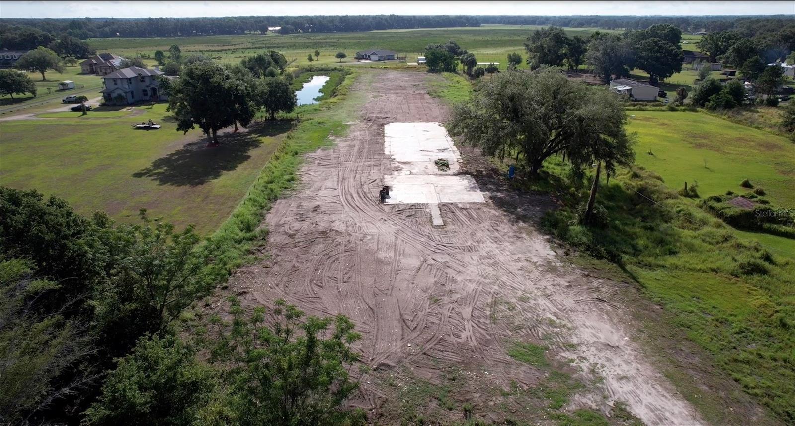 BEAUTIFUL 4.92 ACRES LOCATED IN THE CORK AREA. PROPERTY HAS BEEN COMPLETELY CLEARED EXCEPT CONCRETE SLAB & WELL
20'X100' POND