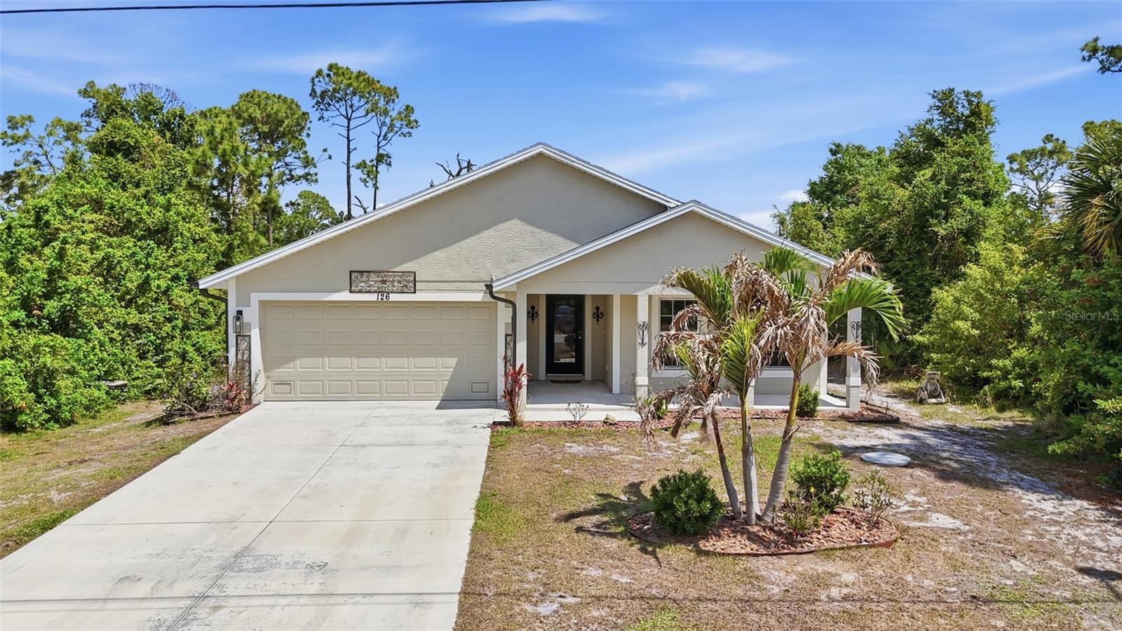 Enjoy easy Florida living in this well-maintained 3-bedroom, 2-bathroom home with a 2-car garage, located in the desirable Rotonda Lakes community. Featuring a welcoming front porch with space for seating, this home offers a bright and open layout with tile flooring throughout and high vaulted ceilings that enhance the sense of space and light. Designed for both comfort and functionality, the open living areas and split bedroom floor plan make this home ideal for everyday living or seasonal use.

RESIDENCE OVERVIEW:
• 3 Bedrooms | 2 Bathrooms
• 2-car garage
• Located in Rotonda Lakes
• Open floor plan
• High vaulted ceilings
• Tile flooring throughout
• Split bedroom layout

INTERIOR FEATURES:
• Inviting front porch with sitting area
• Open living room with glass slider to patio
• Bright and airy layout with natural light
• Seamless flow between living spaces

CULINARY SPACE:
• Kitchen with stainless steel appliances
• Granite countertops
• Center island with breakfast bar
• Closet pantry
• Dinette area off kitchen

PRIVATE OWNER’S RETREAT:
• Spacious primary bedroom
• Dual closets
• En-suite bathroom featuring:
– Dual sink vanity
– Walk-in shower

GUEST ACCOMMODATIONS:
• Guest bedrooms on split floor plan for added privacy
• Built-in closets
• Nearby full guest bathroom

OUTDOOR LIVING:
• Covered back patio perfect for relaxing
• Ideal space for morning coffee or evening unwinding
• Spacious backyard with room to create your own outdoor oasis

A great opportunity to own a comfortable, move-in ready home in a growing community close to beaches, golf, parks, and everyday amenities—perfect for enjoying the Southwest Florida lifestyle.