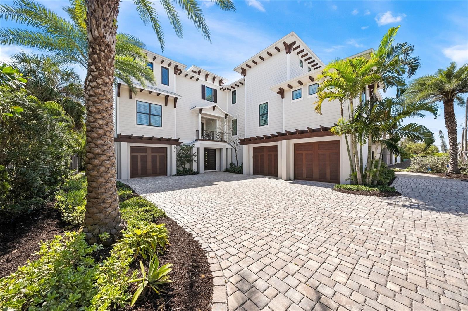 Discover coastal luxury at 209 Willow in the heart of Anna Maria Island on a very sought out quiet street. This stunning canal-front home offers the perfect blend of relaxed island living and high-end amenities, just 10 houses from the pristine sugar-sand beaches of the Gulf while situated on a canal, you get the best of both worlds!   Step inside to this 6 bedroom, 6 bathroom, 2 half bath, thoughtfully designed home.  This home has never been a rental, it is very well taken care of.  The interior has just about every feature you can think of, natural light, soaring ceiling, impact slider doors/windows, wet bar, very large wine cooler, whole house generator for peace of mind, a water filtration system/softener, and a pressure booster.  Each bedroom is spacious and has its own private en-suite bathroom ensuring your family and guests have their own privacy.  Current owners are using the 6th bedroom as an office, or you can turn it into a bedroom. Kids will love the fun built-in bunk bed room, while still plenty of space to play too.  If desired, an upstairs closet has washer/dryer hookups if you wanted an additional set on upper level.   Relax on the rooftop deck with breathtaking views or unwind on the lower deck complete with comfortable loungers. The highlight is the resort-style backyard: a heated pool and spa with a beautiful Shellcrete bar accented by shimmering sea glass. Includes a refrigerator and grill.  A screened-in covered downstairs area provides shaded comfort, while boaters will appreciate the private dock and lift right on the canal—perfect for quick access to the Intracoastal and Gulf waters.  The epoxy-finished 3-car garage adds durability and style to your storage space.  Big outdoor shower so you can rinse off after the sandy beach.   Located on a quiet canal yet incredibly convenient, this home sits in one of Anna Maria’s most desirable spots. Enjoy easy access to world-class beaches, charming island dining, and everything the Florida Gulf Coast has to offer.  Whether you’re seeking a primary residence, a vacation retreat, or an exceptional investment property, 209 Willow Avenue delivers island elegance with every modern comfort.