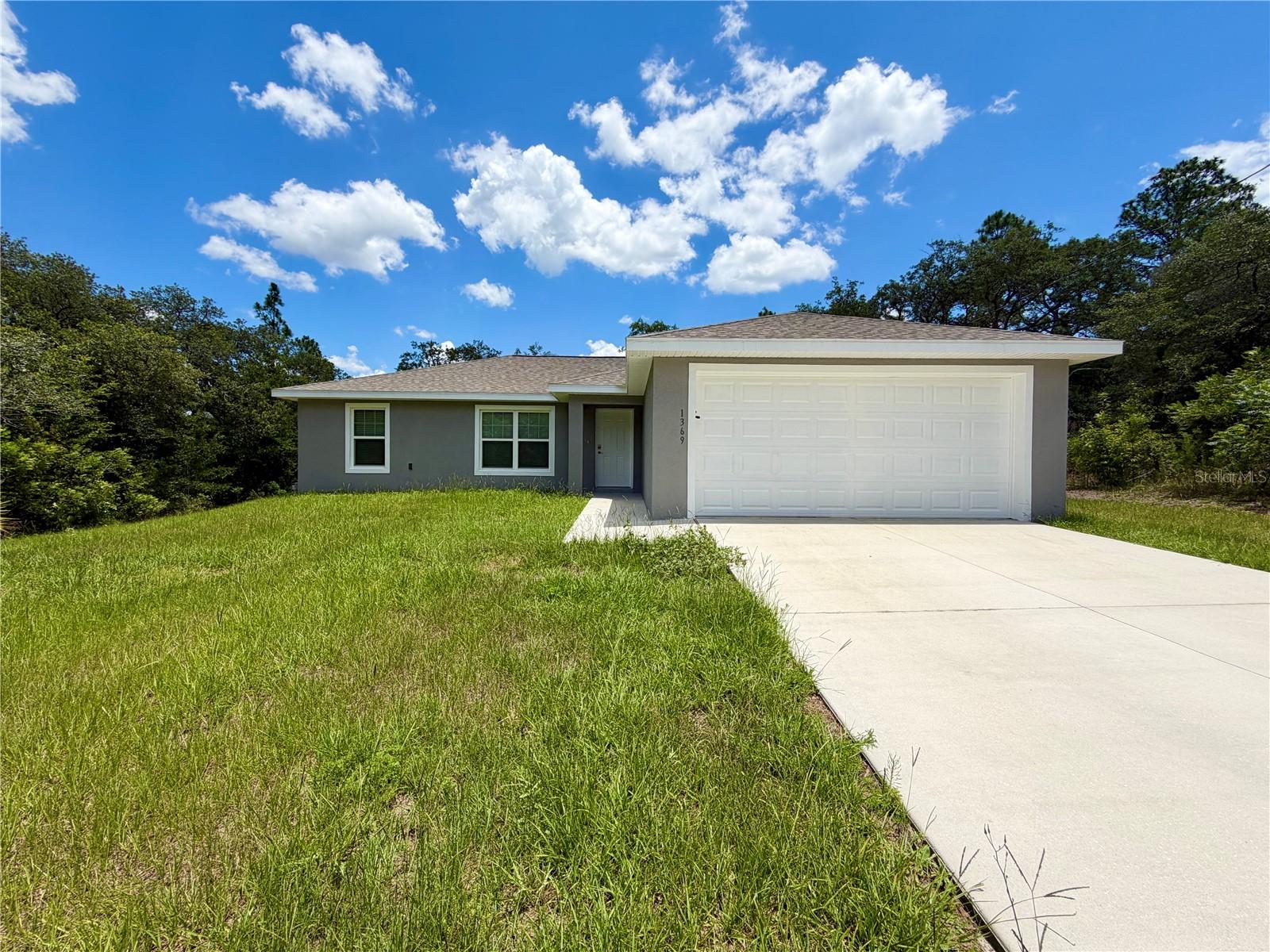 Welcome to this beautiful 2022-built home offering the perfect combination of modern design, comfort, and affordability! Featuring 3 bedrooms, 2 bathrooms, and a desirable split-bedroom floor plan, this move-in ready home is ideal for first-time buyers,  or anyone looking for a low-maintenance Florida lifestyle.

Step inside to an open-concept layout with luxury vinyl plank flooring throughout, creating a stylish and durable living space. The spacious kitchen is equipped with stainless steel appliances, ample cabinetry, and overlooks the living and dining areas—perfect for entertaining family and friends.

The primary suite offers a private retreat with an en-suite bathroom, while two additional bedrooms provide flexibility for guests, a home office, or growing families. Enjoy the convenience of a two-car garage and a generous backyard with plenty of room to relax or create your own outdoor oasis.

Priced at just $249,900, this home presents an incredible opportunity to own a newer construction property at an exceptional value in the growing community of Citrus Springs. Conveniently located near shopping, schools, parks, golf courses, and the area’s beautiful natural springs.

Don’t miss your chance to make this beautiful home yours—schedule your private showing today!