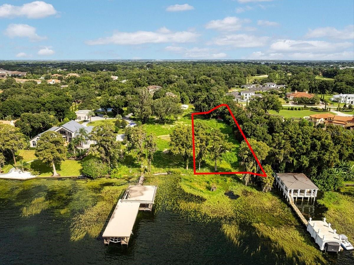 WELCOME TO PARK AVENUE. An extraordinary opportunity awaits on 1 acre of prime lakefront with coveted southeastern exposure and sweeping panoramic views. Perfectly positioned along the pristine shoreline of Lake Butler on the renowned Butler Chain of Lakes, this exclusive homesite is located within one of Windermere’s most desirable gated enclaves—Chaine Du Lac.

Offering the rare distinction of gates within the gates, the property ensures exceptional privacy and security for the custom estate envisioned here. With 100 feet of direct lake frontage, the setting delivers stunning water views and front-row access to the natural beauty, wildlife, and lifestyle that define Florida lakefront living. Property offers a 3' block seawall and NO HOA. All of the benefits of a secure gated community but the freedom to build your dream without restrictions. 

This is a truly rare canvas to bring your vision to life in one of Central Florida’s most prestigious waterfront communities. The possibilities are as expansive as the views. Schedule your private showing today. Adjacent 1 acre lot with dock also available for sale with purchase. Additional information and pricing available upon request.