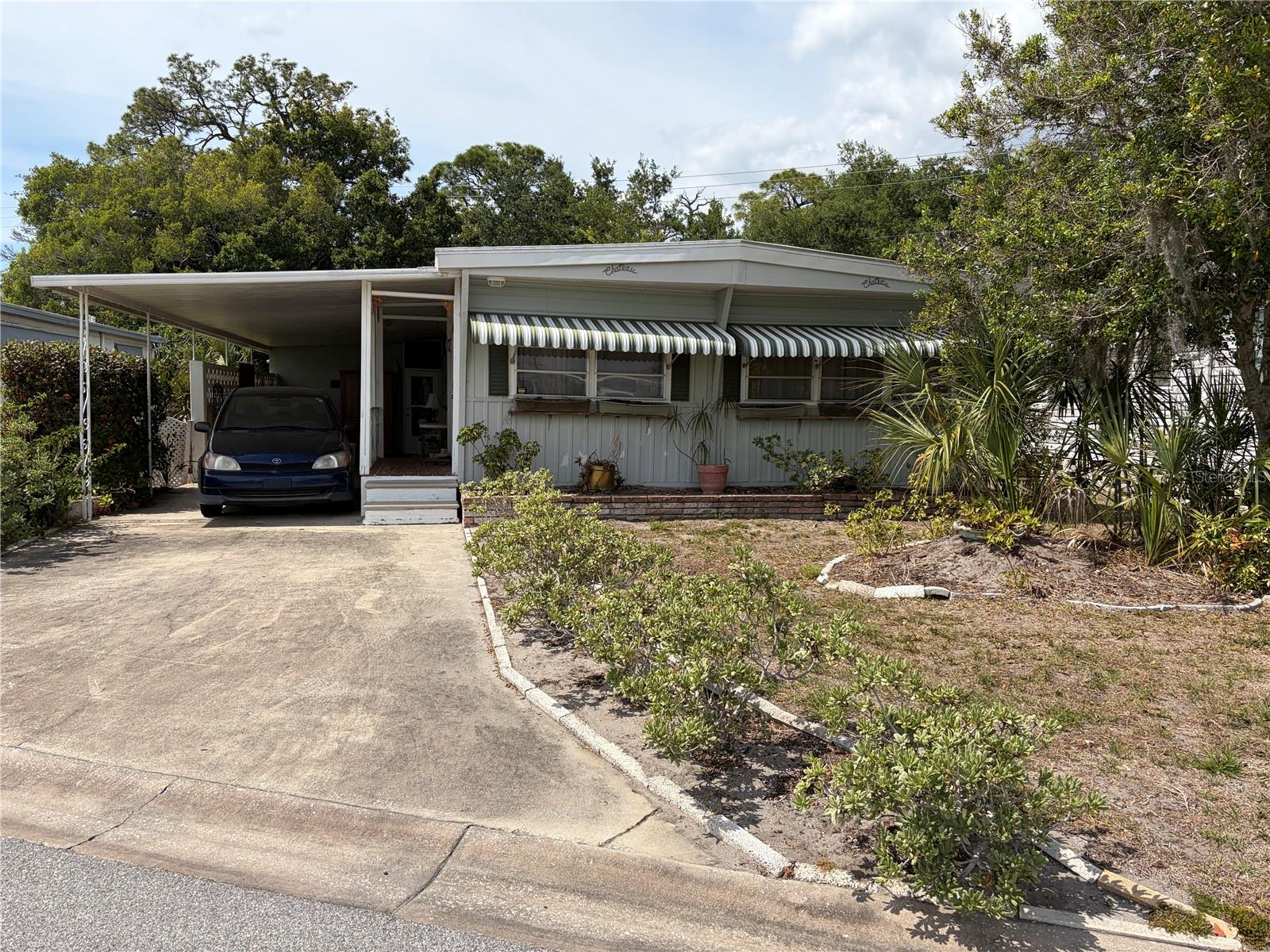 Offered furnished and turnkey, this nicely spaced 2-bedroom, 2-bath home welcomes you with a spacious 45x13 carport, comfortable bedrooms, textured walls and ceilings, newer plumbing, a 2022 gas water heater, laminate flooring throughout, and a TPO roof. You’ll love the bright Florida room with more than 250 square feet and newer acrylic windows, along with a large backyard (home is in the pet area) that backs up to a vacant lot for a little extra peace and privacy. 
Tri-par Estates is a 55+ community that provides a wealth of amenities: enjoy a heated and cooled large pool for year-round swimming, a brand-new spa, tiki hut, pickleball courts, fitness center, shuffleboard, miniature golf, horseshoes, and various recreation hall rooms equipped with ping-pong, billiards, card tables, a kitchenette, sewing areas, and more. The expansive clubhouse regularly hosts dinners, dances, and other events.
Situated only minutes from downtown Sarasota, you’ll have easy access to marinas, shopping, restaurants, museums, the world-renowned Siesta Key and Lido Key beaches, and Sarasota airport.
In this special park and recreation district, residents own their land directly, with no separate HOA fees—an annual fee of $1,648 is included in your property taxes. Internet and TV included in the annual fee This is also a golf cart-friendly community with optional RV or boat storage when available. Don’t miss the opportunity to join this lively, well-established neighborhood in paradise.