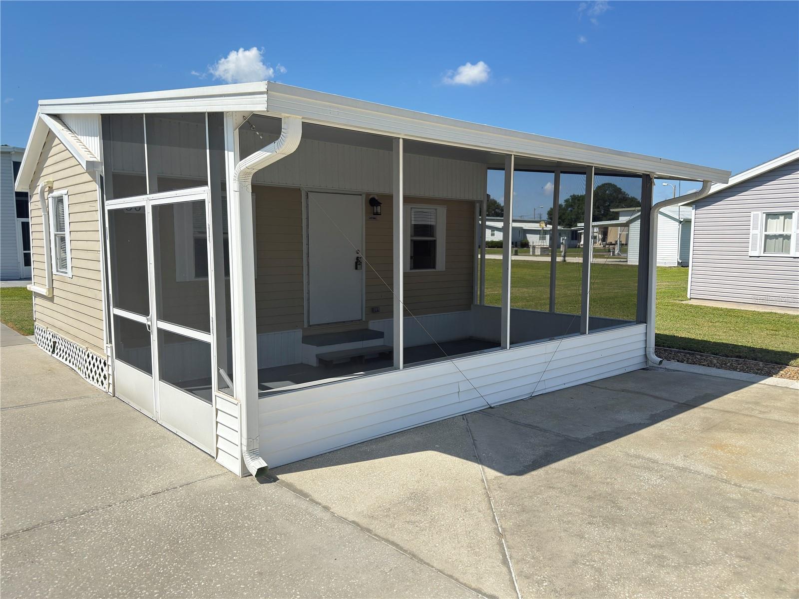 Few opportunities like this surface in one of Central Florida's most established Class A motorhome communities. This generously sized concrete pad is engineered to handle any Class A motorhome, with room to simultaneously host up to two additional guest rigs — all serviced by 200-amp electrical and full RV utility hookups on both sides of the pad.
The climate-controlled casita shed goes well beyond storage. Thoughtfully outfitted for day-to-day living, it includes a comfortable sitting area, mini refrigerator, television, ceiling fan, and a dedicated computer workspace. The full bathroom is equally well-appointed, with a washer and dryer, shower, toilet, sink, water heater, and exhaust fan. Step outside and the attached screened-in covered porch extends your living space even further — a natural spot for morning coffee, evening conversations, or simply enjoying the Florida air without the bugs. Whether you need a guest suite, a quiet home office, a hobby space, or simply a place to decompress — this casita delivers.
The lot's oversized footprint leaves meaningful space for future improvements, including the addition of a manufactured home or an RV port — giving you the flexibility to evolve the property as your lifestyle and priorities shift over time. The annual HOA fee covers basic lawn care and common area upkeep, so the community stays sharp year-round without the burden falling entirely on individual owners.
Sitting just 3.5 miles from I-4, Mount Olive Shores punches well above its weight on convenience. Tampa International, Orlando International, world-class medical centers, major retail corridors, and Central Florida's top attractions are all within roughly an hour's drive.
The newly built 5,000-square-foot Community Center raises the bar for what RV community living can look like — featuring a full commercial kitchen, regulation-size shuffleboard and pool tables, dart boards, arcade games, a card room, library, vending area, and a covered BBQ lanai. A packed social calendar — bingo nights, karaoke, potluck dinners, holiday events, and more — means the community is genuinely alive, not just well-manicured.
Mount Olive Shores is a deed-restricted community. Ownership or lease of a Class A motorhome is required during your first year of residency — a standard that protects the character and long-term value of the neighborhood. This is premium RV real estate in a community that has stood the test of time. Opportunities at this level don't wait.
