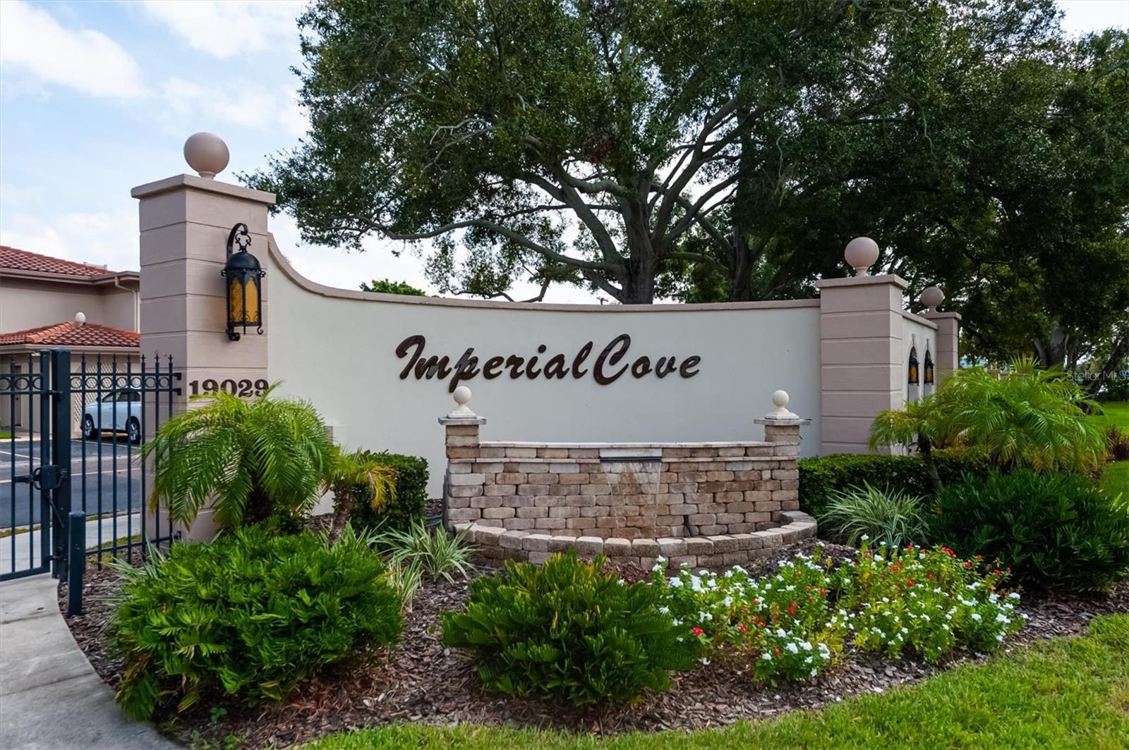 Discover the epitome of carefree living in what may be the best-managed condo community in Pinellas County! This 2-bedroom, 2-bath condo is nestled within the highly sought-after, gated 55+ community of **Imperial Cove**, offering unmatched convenience in the heart of Pinellas County. Located on the second floor conveniently with an elevator and a southeast exposure. Complete with an "in unit" laundry room for added convenience and your own dedicated carport. Amenities include gated community an active clubhouse, heated salt water pool, fitness center with access to sauna and showers, shuffleboard, putting green, outdoor grills, a library, a lit walking path with gorgeous water views of Tampa Bay and so conveniently located in Central Pinellas County, with quick access to everywhere. Fees include water, sewer, trash, exterior maintenance, grounds maintenance, roof and more. A must see community!