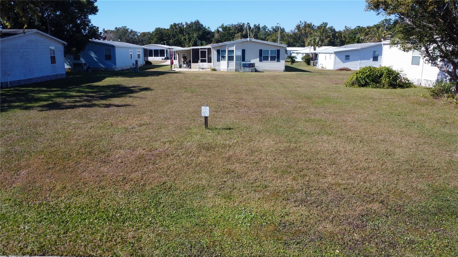 Welcome to Lot 81 in the highly sought-after, resident-owned Forest Glenn 55+ Mobile Home Park.
Nestled in peaceful Spring Hill, FL, this property offers an exceptional opportunity to build your ideal home in a community known for its quiet streets, friendly neighbors, and unbeatable convenience. With a low Co-Op fee of just $220/month, residents enjoy a generous list of included services and amenities: Lawn service, Dumpster service for household trash, Community storage yard access, Full use of all Forest Glenn amenities. Forest Glenn features a community pool, clubhouse, shuffleboard courts, horseshoes, and a billiard room—perfect for staying active and enjoying the Florida lifestyle. The community also maintains all streets, storm drains, and street lights, ensuring a clean and well-kept environment year-round. Ideally located near Hernando Beach, residents have quick access to seafood restaurants, serene fishing spots, and unforgettable Gulf Coast sunsets. Nearby Spring Hill offers outdoor shopping plazas, hospitals, and medical offices for everyday convenience. For recreation, enjoy Weeki Wachee Mermaid Park, kayak the crystal-clear Weeki Wachee River, or soak up the sun at Rogers Park and Pine Island Beach. Lot 81 at Forest Glenn delivers affordability, comfort, lifestyle, and location all in one. Your Florida adventure begins here.