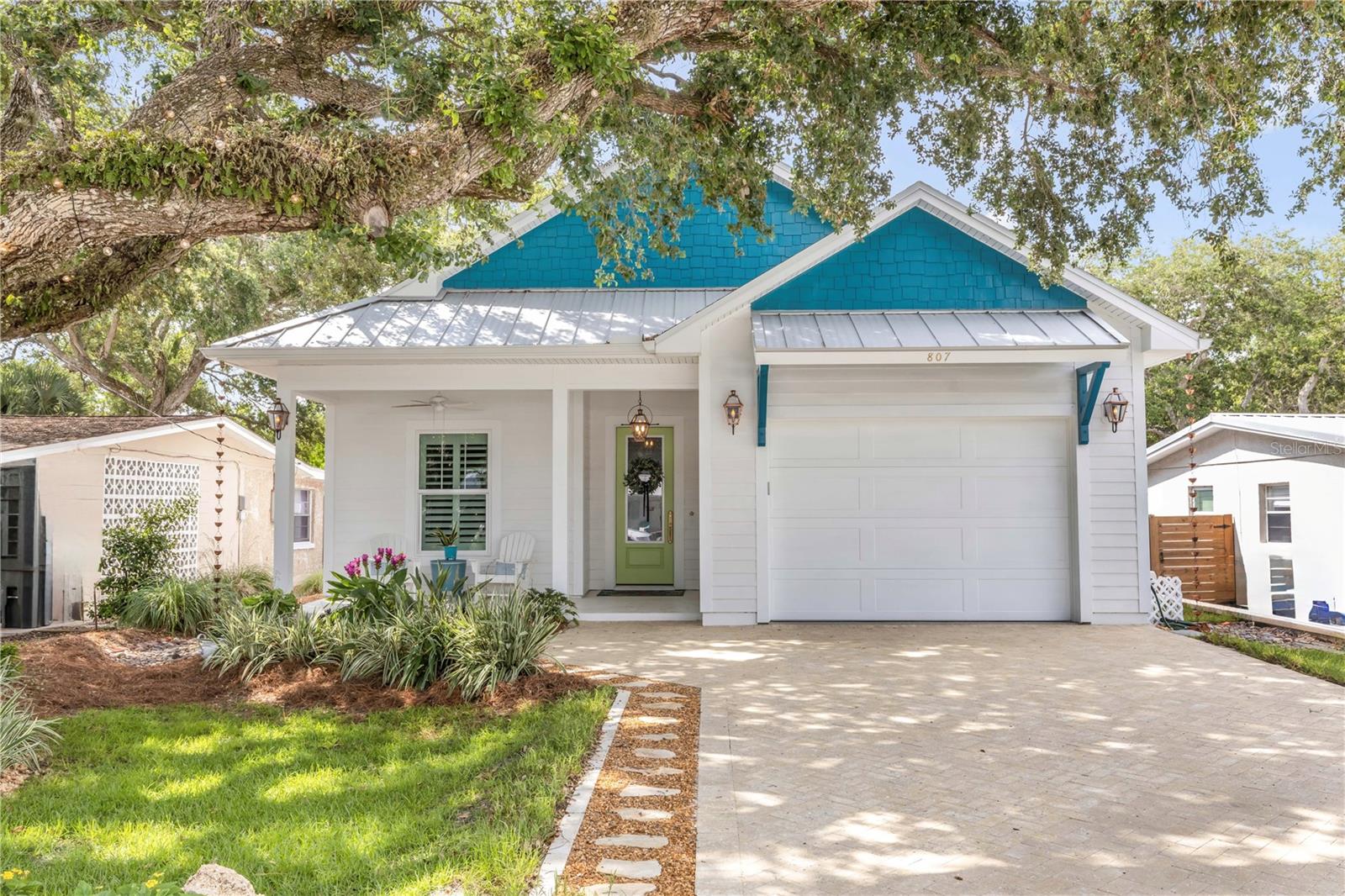 Experience the best of coastal luxury living in this custom-built beachside residence completed in October 2024. Ideally located on a quiet interior street just steps from the ocean, this thoughtfully designed home is approximately ¼ mile from direct beach access and moments to Flagler Avenue’s popular restaurants, shopping, and entertainment.
Designed for effortless single-story living, this open-concept home features soaring 10-foot and vaulted ceilings, 8-foot doors, designer finishes, and a desirable split-bedroom floor plan. The flexible layout includes a luxurious primary suite with a spa-inspired en-suite bath, plus two additional rooms that can serve as guest bedrooms, a home office, bonus room, or Florida room to fit your lifestyle.
The gourmet kitchen is a true centerpiece, showcasing custom cabinetry, stunning quartzite countertops, premium Bosch, Z-Line, and Samsung appliances, a dual-fuel range, solid hammered copper sink, brass fixtures & pot filler, and custom lighting throughout. A built-in dining banquette adds both charm and functionality.
Every detail reflects quality craftsmanship, including limestone tile flooring, custom natural stone shower mosaics, designer window treatments, custom built-ins, extensive storage, and a Frame TV with art display feature. The primary bath offers a level-entry custom shower, handmade mirrors, solid brass fixtures, and custom cabinetry.
Built with durability and peace of mind in mind, the home features hurricane-rated windows and doors, all-new HVAC, plumbing, and electrical systems, a surge-protected electrical panel, whole-house water filtration and softener system, gas tankless water heater, French drain system, multi-zone irrigation, and oversized gutters with leaf guards.
Outdoor living is equally inviting with a covered patio, outdoor shower, stone pathway and mature landscaping on a wooded lot. The oversized 1.5-car garage features a professionally finished floor, Wi-Fi-enabled garage door opener with camera, and additional attic storage.
With no HOA, no flood zone designation, and 30-day rentals permitted, this exceptional property offers the perfect combination of luxury, location, flexibility, and investment potential in one of New Smyrna Beach’s most desirable beachside neighborhoods.