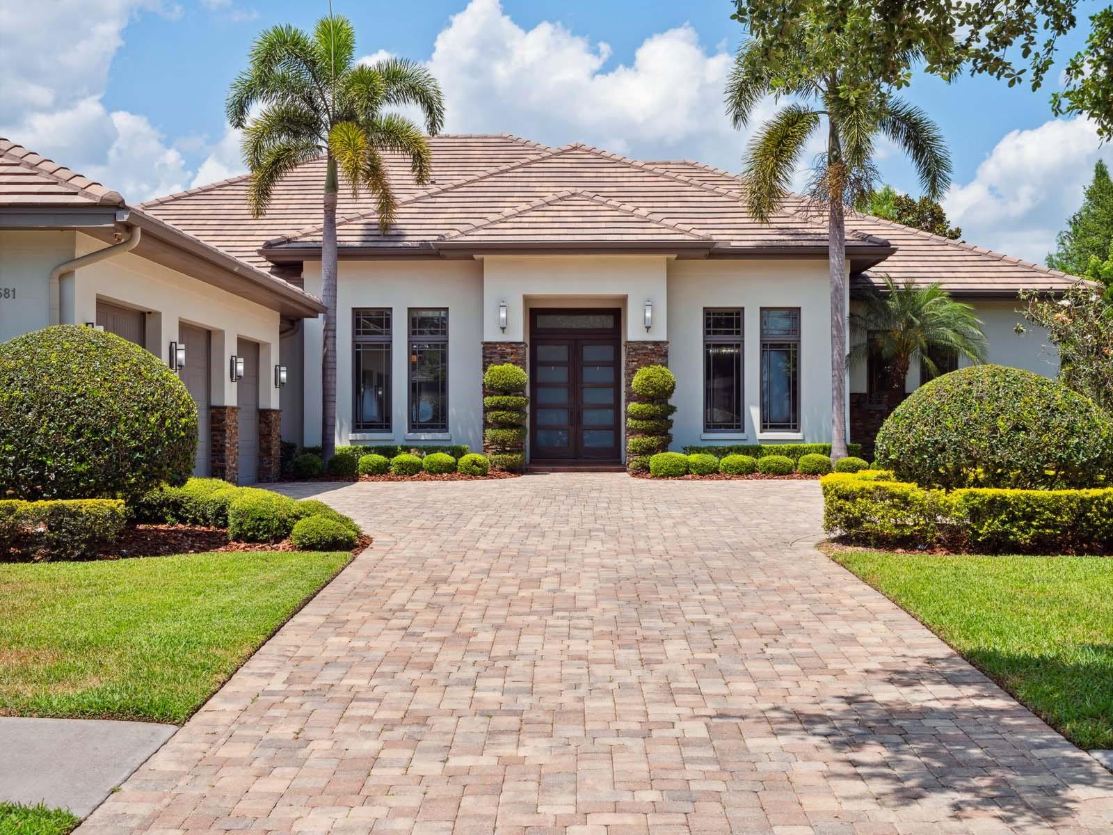 Custom built in 2015 by Maroon Fine Homes, this beautiful single-story residence is perfectly situated within the gates of Lake Nona Golf & Country Club in proximity to all that the Club has to offer. 

Designed for indoor and outdoor living, this home offers four bedrooms, four full and one half bathrooms plus more than 2,500 square feet of exterior living space overlooking sparkling water views.  

Featuring warm and modern interior design, by Niemann Interiors, the home strikes a perfect balance of relaxed elegance. Walnut wood floors travel throughout the interior, from the foyer and great room to the kitchen, dining room and dedicated home office. 

Beautiful finishes including smooth stained beams in the great room, along with extensive interior architectural details further enhance these primary living areas. The kitchen offers a walk-in pantry, waterfall center island, appliances by Wolf and Sub-Zero and rich, custom all-wood cabinetry.   

The home’s outdoor living area features an expansive pool colonnade with a covered walkway leading from the owner’s suite to the media/game room. With additional, glass sliders providing access from both the dining room and the great room, the covered lanai features a summer kitchen and a freestanding, three-sided fireplace. This relaxing retreat creates the perfect place to enjoy warm Florida evenings. 

Additional features include: 
• Private Owner’s Suite with expansive walk-in closet, spa tub and walk-in shower 
• Spacious Laundry Room
• Pool Bath 
• 3-Car Garage