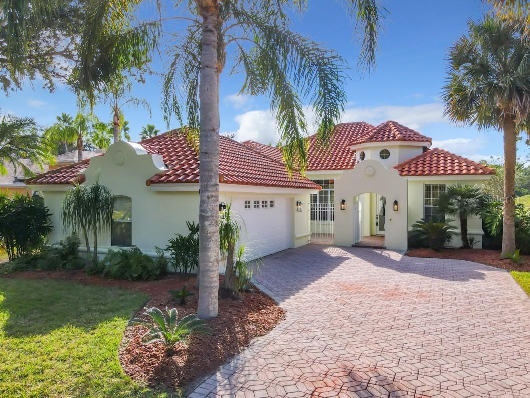 Beautiful LPGA! Lovely & sunny home with huge, covered lanai looking directly onto the 15th fairway of the Jones course. Tile roof 2018. Guests are greeted in the spacious tile foyer with soaring 16' ceiling opening to the bright & airy Dining & Family room. Enjoy the fireplace on those upcoming cooler evenings. Wonderfully upgraded kitchen with honey colored solid wood cabinetry, white Quartz countertops, stainless single bowl sink, new chrome faucet, new dishwasher, new garbage disposal and recessed perimeter lighting will certainly inspire your culinary creativity! Upgraded bathrooms with porcelain floor tiles, granite & quartz countertops, crystal vanity lights, commode & gorgeous free standing soaking tub in the primary bathroom. New ceiling fans throughout the house & lanai. New Natural gas Hot Water tank. 2 additional nice size bedrooms and a ton of closets for storage. Welcoming gated front entrance courtyard, tastefully updated landscaping & side entry OVERSIZED 2 car garage all add to the wonderful curb appeal of this special home.