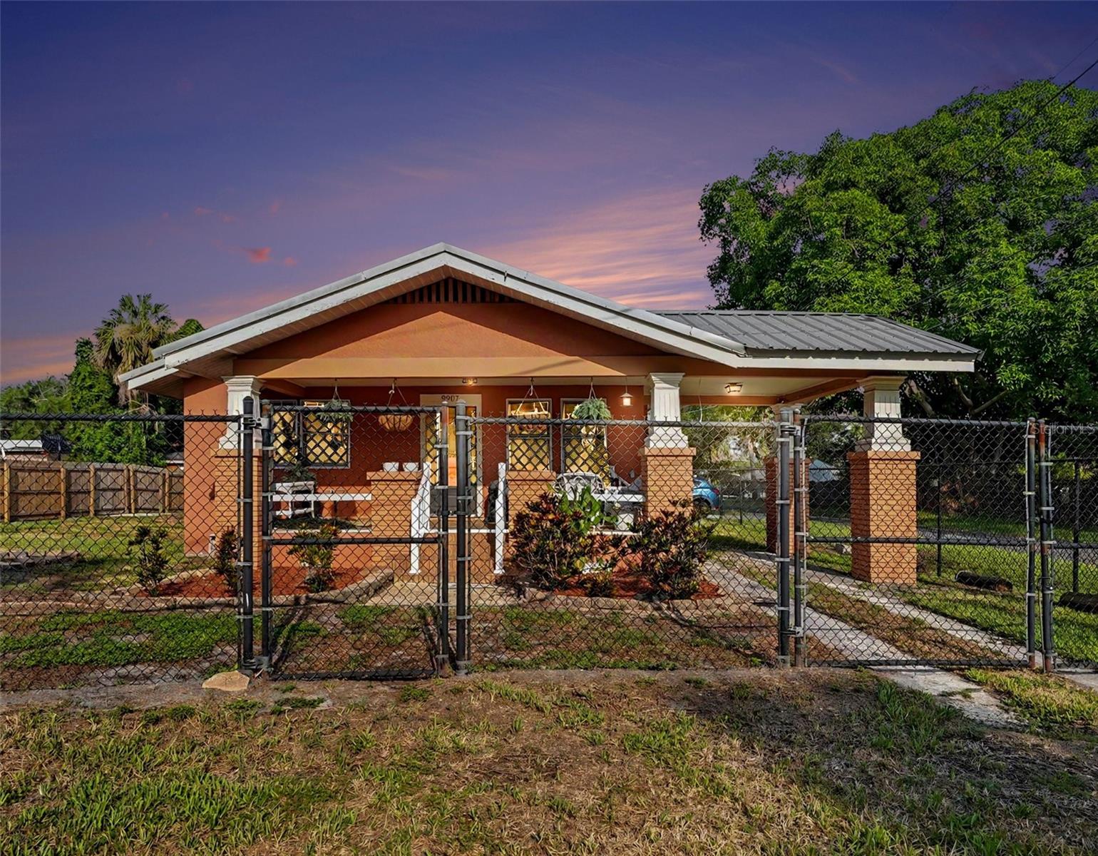 NO HOA • NO CDD • NO DEED RESTRICTIONS • Spacious Corner Lot! Welcome to 9907 Maggie St, a beautifully maintained 3-bedroom, 2-bath home offering 1,344 square feet of comfortable living in the heart of Gibsonton. This move-in ready home features durable wood flooring throughout, a functional split-bedroom floor plan, a huge laundry room with additional storage, and an oversized 2-car garage. A covered carport and expansive fenced backyard provide plenty of space for entertaining, pets, gardening, and outdoor living. Bring your boat, RV, trailer, or ATV—there are no HOA or deed restrictions limiting how you enjoy your property. Located less than one mile from the Alafia River and nearby public boat ramps, this home is perfect for boating and outdoor enthusiasts. Conveniently situated near I-75, US-41, shopping, dining, schools, and everything the Tampa Bay area has to provide, you'll enjoy both comfort and convenience. Whether you're a first-time homebuyer, downsizing, or simply looking for a property with room to spread out and the freedom that's hard to find today, this home is ready for its next owner. Schedule your private showing today! Available for quick occupancy after July 31, 2026