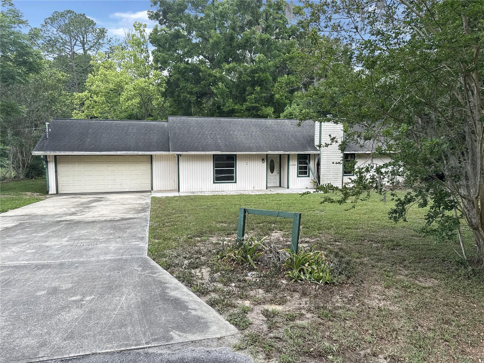 Come check out this this 3-bedroom, 2-bathroom home with a 2-car garage situated on a spacious .74-acre lot in desirable Southeast Ocala. Featuring a split-bedroom floor plan, this property offers a functional layout with separation between the primary suite and guest rooms for added privacy. Conveniently located near shopping, dining, schools, medical facilities, and with easy access to major roadways for commuting, this property is positioned in an established area with room to make it your own. The generous lot provides plenty of outdoor space for entertaining, storage, gardening, or future possibilities. A unique opportunity for buyers looking for space, location, and value in Ocala. Schedule your showing today!