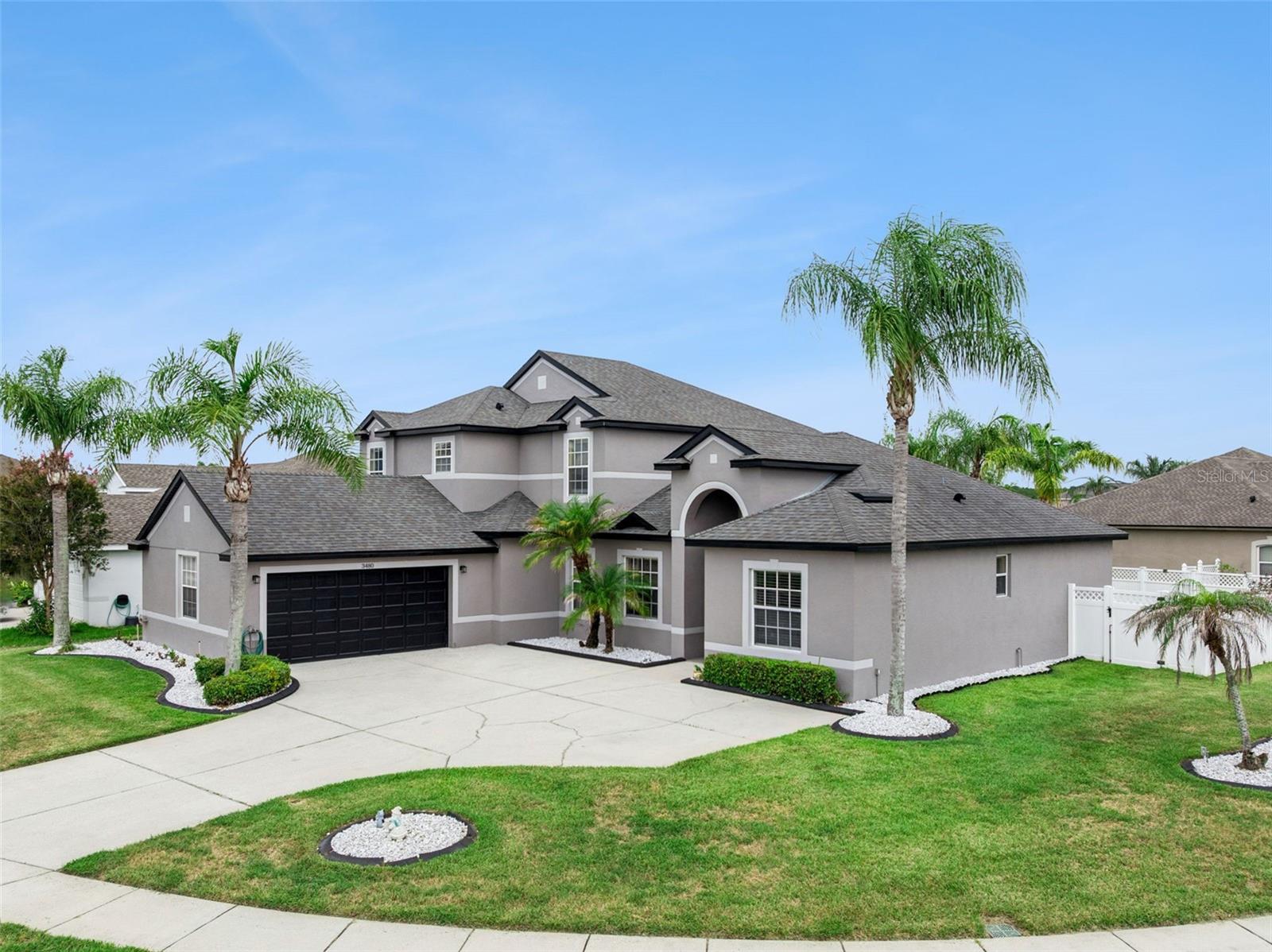 SPECIAL FINANCING AVAILABLE THROUGH PREFERRED LENDER!! Welcome to 3480 Forest Ridge Lane in the sought-after gated community of Weston Reserve, where spacious living, thoughtful updates, and an unbeatable Central Florida location come together. Situated on a beautifully landscaped corner lot, this impressive 4-bedroom, 3.5-bath pool home offers over 3,100 square feet of living space designed for both everyday comfort and memorable gatherings. From the moment you arrive, you'll appreciate the home's attractive curb appeal, oversized driveway, mature palm trees, and inviting height entry. Inside, the flexible floor plan features formal living and dining areas, expansive gathering spaces, and a seamless flow throughout the main living areas. The first-floor primary suite provides convenience and privacy, while the additional bedrooms offer generous space for guests, hobbies, or a home office. The updated kitchen is the heart of the home, featuring painted cabinetry, spacious countertops, subway tile backsplash, kitchen appliances, a center island, breakfast bar, and an extended butler's pantry complete with additional cabinetry and a prep sink—perfect for entertaining or everyday organization. Luxury vinyl plank flooring enhances the formal living areas, while the spacious family room opens effortlessly to the outdoor living space. Step outside to your own private Florida retreat featuring a screen-enclosed pool and spa, expansive covered lanai, and a fully fenced backyard with plenty of room to relax, entertain, or enjoy the outdoors year-round. Additional highlights include interior and exterior paint, updated flooring, refreshed bathrooms, an oversized laundry room with utility sink and cabinetry, and a side-entry garage. Weston Reserve residents enjoy a gated entrance and convenient access to everyday essentials. Located just minutes from The Loop, you'll find shopping, restaurants, entertainment, and grocery options close by. Commuters will appreciate easy access to Osceola Parkway, John Young Parkway, SR 417, SR 528, Florida's Turnpike, and I-4, placing Orlando International Airport, Downtown Kissimmee, Celebration, Lake Nona Medical City, and Walt Disney World Resort all within a convenient drive. If you're searching for a home that offers generous living space, a private backyard oasis, and one of Kissimmee's most convenient gated locations, 3480 Forest Ridge Lane is ready to welcome you home. Low rate VA loan is assumable for eligible buyer.