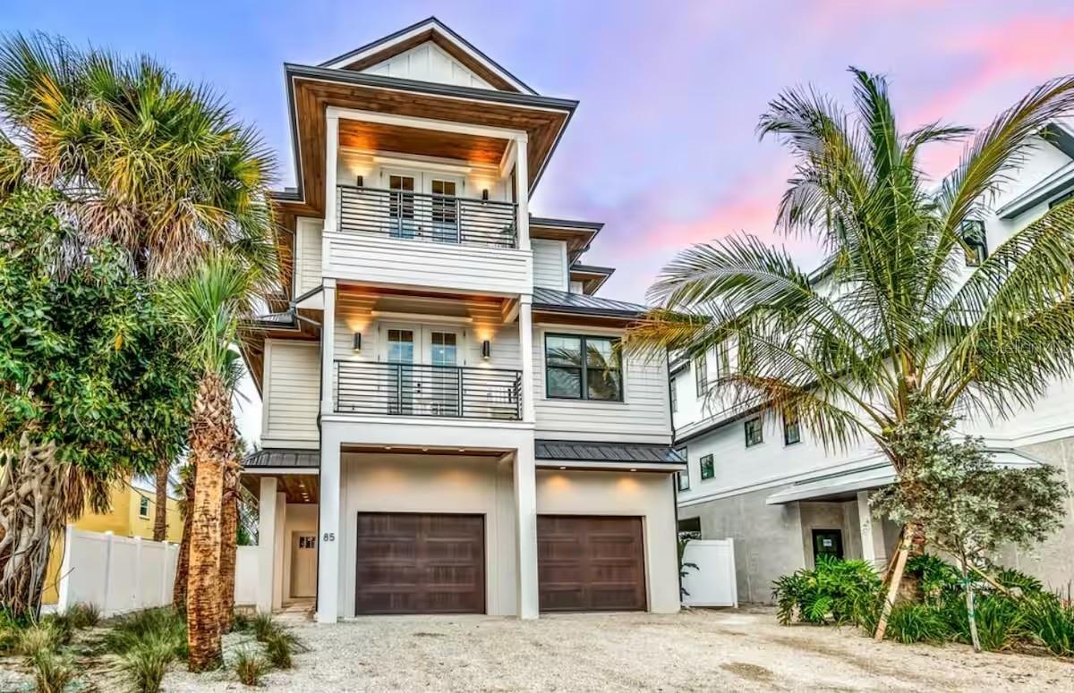 Unlock a rare opportunity to own a high-performing nightly-rentable vacation property in the coveted Golden Triangle of Siesta Key—one of the most desirable short-term rental zones on the Key. This turnkey residence is already operating as a successful short-term vacation rental, offering immediate income with future bookings in place.
Positioned just steps from Siesta Key Village and world-famous Siesta Beach, this property sits in the heart of the island’s premier tourism district, where nightly rentals are fully permitted and demand remains consistently strong year-round. Guests love the walkability, the proximity to dining and entertainment, and the effortless beach access—making this an ideal asset for investors seeking reliable occupancy and premium nightly rates.
A luxurious Siesta Key retreat just steps from the beach, offering Gulf views, resort-style outdoor living, and high-end finishes throughout. With six bedrooms, 6.5 bathrooms, an elevator, multiple decks, a rooftop terrace, and an incredible pool with a slide, this home blends elegance with fun. Its unbeatable location—one minute to the beach and 3 minutes to Siesta Key Village—makes it ideal as a primary residence, vacation home, or high-performing investment property.