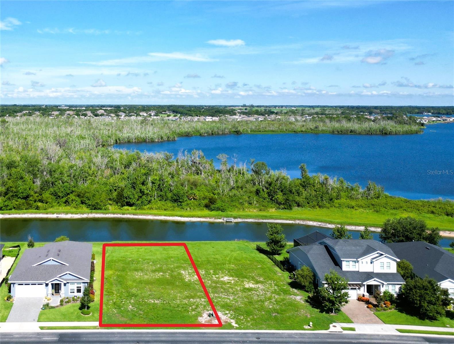 This desirable WATERFRONT, CONSERVATION LOT will feature a GORGEOUS, CLOSE LAKE VIEW through your dream built custom home.  
One of the very best “almost lake front lots” 
this one originally sold for $131K !!!  Nearly a full quarter of an acre, this lot is able to accommodate a large variety of house plans, as well as being in a PREMIUM LOCATION, very close to Lake Van and one of the furthest away from the main road, ideally situated for peace and quiet.

Water Ridge features private Boat Launches (RV and Boat Storage) for their 3 lakes (Boating, Fishing and Water Skiing), as well as an elegant Clubhouse that includes a large Fitness Center and Finnish Sauna.  Enjoy 3 Resort Style Pools, Outdoor Grills, Community Center, Tennis Court and Pickleball.  Very reasonable HOA and no CDD!  Water Ridge is a secure GATED community with PERIMETER FENCING that is conveniently located in Auburndale, FL between Orlando and Tampa with easy access to Disney, Universal, Beaches, Preforming Arts, Shopping and Dining.