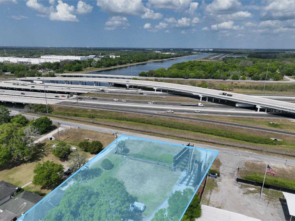 5305 Garden Lane is a fully tenanted Industrial Outdoor Storage asset generating clean current cash flow under a triple-net commercial lease with AutoBase LLC, operating under the VMS Solutions brand under a "Road Rangers" contract with FDOT. The primary lease runs through February 2028 with an additional one-year tenant renewal option, structured triple-net with real estate taxes flowing through to the tenant. Supplemental income is generated through a long-term billboard ground lease with Clear Channel Outdoor featuring guaranteed annual base rent plus a percentage of net advertising revenues — an inflation-protected income stream with auto-renewal mechanics that extend the lease term effectively into perpetuity. Lease terms, rent structure, and contractual provisions for both tenants are available to qualified buyers under NDA.

Seller will give qualified buyers access to AutoBase during the due diligence period to potentially negotiate an extension of the existing lease prior to closing. This is an uncommon and meaningful concession. A successful extension converts the asset from a short-tail net lease into a long-WALT credit-tenant IOS investment, with material cap rate compression and value enhancement that accrues directly to the buyer at acquisition. Pre-closing tenant engagement, combined with the property's strategic I-4 location and zoning flexibility, gives the right buyer a clear multi-year value creation roadmap from day one.

AutoBase LLC (operating under the VMS Solutions brand) is a national fleet management and vehicle operations company with a multi-decade operating history serving utility providers, telecommunications operators, municipal governments, and transportation authorities across the United States. AutoBase is part of the AutoBase Holdings LLC corporate structure following a 2025 ownership transaction. The tenant occupies the site as a regional fleet storage, dispatch, and crew staging facility — a built-out operational footprint with significant relocation friction and high renewal probability.


Clear Channel Outdoor is one of the largest outdoor advertising operators in the United States, with billboard structures positioned to capture I-4 corridor traffic. The lease structure provides a guaranteed annual floor plus percentage participation in net billboard revenues, allowing the income to grow with billboard advertising market rates over time. The lease's 30-year initial term and auto-renewal provisions make this a long-term, effectively perpetual income stream.

The General Commercial zoning category is among the most permissive in unincorporated Hillsborough County. CG permits commercial, light industrial, outdoor fleet storage, truck parking, contractor yard, retail, and a broad range of permitted-by-right uses. This zoning flexibility supports current tenancy without restriction and preserves multiple future-use pathways for buyers contemplating eventual repositioning, expanded operations, or redevelopment.

A rare convergence of income, optionality, and location. Income today from two creditworthy national tenants. Optionality through seller-facilitated lease extension access. Premier I-4 location in a submarket where comparable infill IOS land does not come available. Comprehensive offering package, lease abstracts, and detailed pro forma available to qualified buyers under NDA.

All Reasonable Offers and Terms Considered.  Brokers Protected.