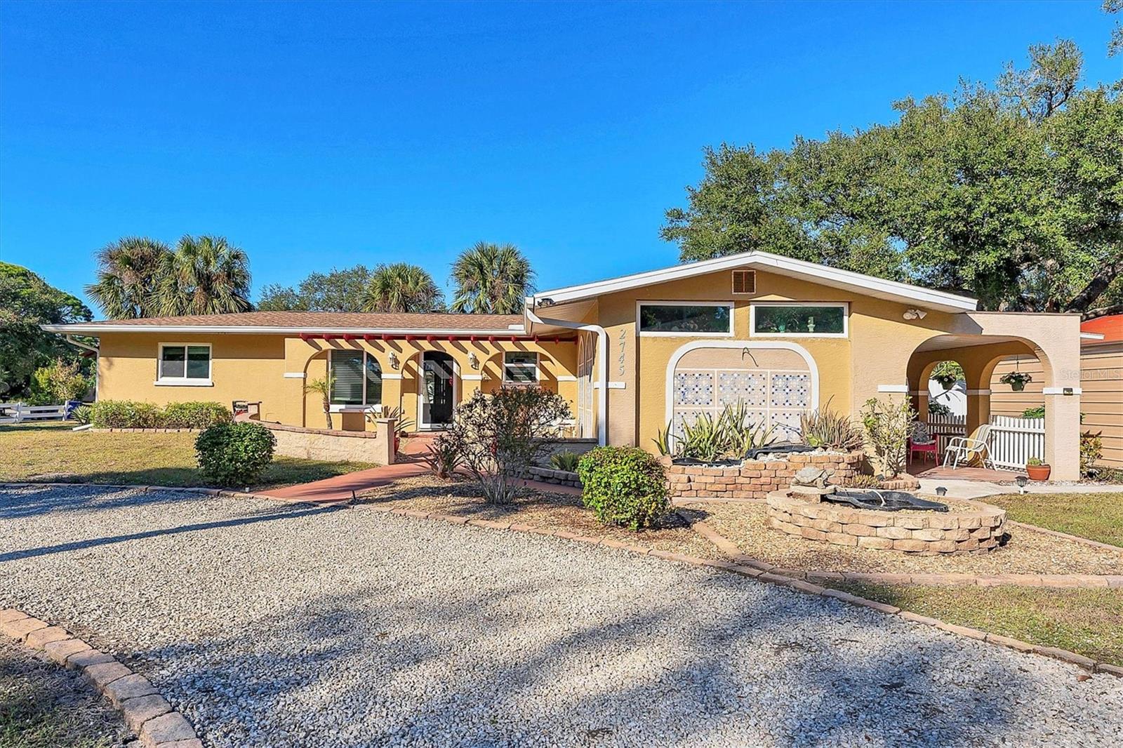 RARE FIND with IN-LAW QUARTERS and charming PRIVATE ENTRANCE through a COVERED SIDE PORCH graced with 5 ARCHES and a TERRACOTTA TILE floor. Walking up to it I was drawn to just sit a spell. It is NO SURPRISE that the current owner has had a HISTORY of loyal RETURNING SEASONAL RENTERS. Use it as you wish, ART STUDIO, home office, GUEST HOUSE, home for AGING PARENT’S distance from the teenagers or DUAL LONG TERM RENTAL income.

This CHARMING home is situated on a 4 LOT PARCEL caressed with DOUBLE functioning FOUNTAINS and MATURE PALMS and OAK TREES. Feel the TRICKLING FOUNTAINS melt the stress as you approach the front door. Step inside and notice the crown molding, light neutral homogenous flooring and FRENCH DOORS that lead to an additional WINDOWED ROOM overlooking the SPACIOUS YARD. From there step outside onto the BRICK PAVED PATIO to catch the Florida sunshine.

Not only is this home inviting, warm and cozy, but once you move in you can start relaxing and enjoying it immediately. The big projects are done, a NEW ROOF and new HURRICANE IMPACT WINDOWS installed 2025. The kitchen and baths have also been updated. 

BRING all your BIG LAND and SEA TOYS and PARK them on either of the two rock driveways or in either side yard or pull them into the 20 X 20 THREE SIDED STEEL CARPORT. This is the coveted South Venice Neighborhood where there are NO HOA’s. And those toys have a NEARBY PARK TO PLAY at the PRIVATE BOAT LAUNCH to the GULF. RESIDENT MEMBERSHIP is renewed at just $200.00/year. No boat? No problem, the same park offers a PRIVATE FERRY to a SECLUDED BEACH ISLAND, resident membership $150.00/year. Don’t want to wait for the ferry, the KAYAK LAUNCH is $100.00 /year. This park is less than 3 miles away and is also near the SOUTH VENICE YACHT CLUB and the CIVIC COMMUNITY CENTER where renovated PICKLE BALL COURTS are enjoyed. Here they host classes and events in the social hall.

Even closer at 1.5 miles is THE SHAMROCK NATURE CENTER with a playground, Children’s butterfly garden, TENNIS COURTS and access to the LEGACY TRAIL for a ride all the way up to Sarasota. 

Head just a few miles in either direction and enjoy the QUAINT TOWNS and BEACHES of HISTORIC VENICE or the OLD FLORIDA VIBE of ENGLEWOOD. Both towns offer dining, festivals, farmer’s markets and parks. Both offer their own unique “CHILL VIBE” with, their ART CENTERS and BEACH YOGA at SUNRISE or SUNSET, and DRUM CIRCLE and STREET MUSIC and CONCERTS at the center of town GAZEBO.

Join the VENICE GARDEN COMMUNITY POOL or ADD A POOL in your own expansive yard. The current owner has investigated splitting the lot or adding an additional guest house on the property so there is plenty of room to grow in place in any direction. Even GRANDMA can enjoy peer fellowship and activity at nearby SENIOR FRIENDSHIP CENTER.


This is the most AFFORDABLE ACTIVE FLORIDA LIVING. Something for EVERY AGE. A-LA-CARTE AMENITIES with NO CDD’S or HOA RULES.