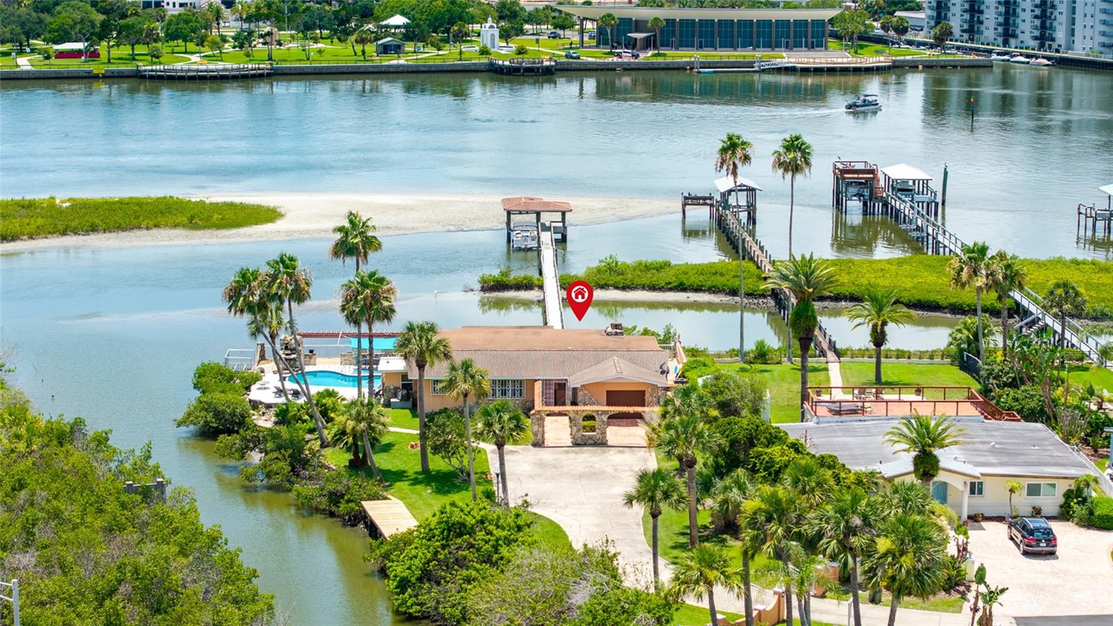 EXCLUSIVE HALF-ACRE PLUS WATERFRONT RETREAT in EMERGING NEW SMYRNA BEACH — WHERE DIRECT INTRACOASTAL ACCESS MEETS SMART LONG-TERM INVESTMENT IN A BOATER’S COASTAL PARADISE.

Tucked away on a quiet dead-end street, this rare 0.58-acre private oasis (over half an acre) commands dual waterfront frontage on both a SHELTERED CANAL AND THE INTRACOASTAL WATERWAY itself. This updated 3-bedroom, 3-bath pool home (2,391 sq ft, built 1972 with meaningful renovations) delivers immediate luxury living for discerning boaters and INVESTORS SEEKING SCARCE FLORIDA WATERFRONT WITH STRONG APPRECIATION DRIVERS.

Step into a true boater’s lifestyle: Your private canal-front dock and riverfront boathouse with dock provide seamless access to the Intracoastal Waterway’s pristine waters. Cruise to Ponce Inlet for Atlantic adventures, drop lines for world-class inshore fishing, or simply drift among dolphins, manatees, and abundant wildlife right from your backyard. UNOBSTRUCTED ICW VISTAS UNFOLD FROM THE EXPANSIVE REAR PATIO/LANAI AND THE SIGNATURE FLORIDA ROOM/RIVER ROOM — COMPLETE WITH FIREPLACE AND WET BAR — PERFECT FOR ELEVATED ENTERTAINING, SUNRISE COFFEES, OR SUNSET TOASTS OVERLOOKING YOUR DOMAIN.

Inside, sophisticated coastal character shines through wood beam ceilings, plantation shutters, an updated kitchen with granite counters and stainless appliances, two new AC units, and fresh landscaping. A long driveway offers generous parking for boats, trailers, and guests, while the private courtyard pool creates an intimate resort feel on your expansive lot.

Investment-strengthened by location and momentum: Conveniently positioned minutes from Flagler Avenue’s upscale shops and dining, pristine beaches, and vibrant Canal Street, this property also aligns with New Smyrna Beach’s forward trajectory. Ongoing FDOT infrastructure enhancements along SR 44 — including resurfacing, turn lanes, signals, and connectivity upgrades through 2030 — are UNLOCKING THE WESTERN GROWTH CORRIDOR, SUPPORTING POPULATION INFLUX, JOB CREATION, AND SUSTAINED DEMAND FOR PREMIUM WATERFRONT ASSETS LIKE THIS.

Adding further upside is NEW SMYRNA BEACH'S STRATEGIC POSITION WITHIN FLORIDA'S EXPANDING SPACE COAST ECONOMY. Located approximately 46 miles from the world-renowned Kennedy Space Center, residents enjoy front-row access to spectacular rocket launches from area beaches while benefiting from the ECONOMIC RIPPLE EFFECTS OF ONE OF THE NATION'S FASTEST-GROWING AEROSPACE CORRIDORS. VOLUSIA COUNTY IS ACTIVELY PURSUING AEROSPACE EXPANSION THROUGH INITIATIVES SUCH AS THE COMMERCIAL SPACE INDUSTRY OPPORTUNITY OVERLAY AND THE FLORIDA SPACE INNOVATION CENTER, HELPING ATTRACT INVESTMENT, INNOVATION, AND HIGH-PAYING JOBS. THE CONTINUED GROWTH OF EMPLOYERS INCLUDING NASA, SPACEX, BLUE ORIGIN, AND THEIR EXTENSIVE SUPPLIER NETWORKS IS FUELING POPULATION GROWTH, ECONOMIC DIVERSIFICATION, AND INCREASED DEMAND FOR DESIRABLE COASTAL REAL ESTATE THROUGHOUT THE REGION.

Dual-waterfront estates of this caliber with boathouse, dock, and generous acreage surface infrequently in New Smyrna Beach. SECURE IT AS YOUR PRIMARY LUXURY RESIDENCE, HIGH-END VACATION ESCAPE, OR INCOME-PRODUCING INVESTMENT (STRONG APPEAL FOR SEASONAL BOATERS AND RELOCATORS).

INTRACOASTAL LUXURY. BOATER’S DOMAIN. GROWTH-ORIENTED INVESTMENT.

Schedule a private tour TODAY. This isn’t just a property — it’s your gateway to an exceptional Florida waterfront legacy with built-in upside.