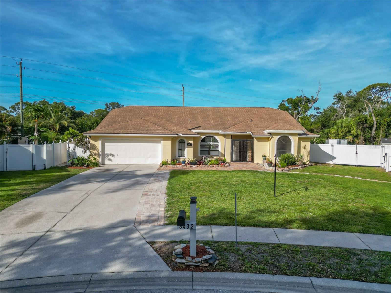 Discover this beautiful home in the highly sought-after community of Palm Lakes! This pool home is bathed in natural light, thanks to its large arched windows and soaring vaulted ceilings in the main living areas and the primary bedroom. A split-bedroom floor plan for both privacy and functionality, making it perfect for families or entertaining guests.

The spacious kitchen offers ample cabinet and counter space, and seamlessly opens to the inviting family room and cozy breakfast nook. The primary suite features elegant bamboo flooring, a generously sized walk-in closet, and a large En-Suite bathroom. Sliding glass doors from the primary bedroom provide direct access to the pool area, creating a harmonious indoor-outdoor flow.
The pool area boasts a large covered patio ideal for lounging or dining alfresco, with plenty of additional space for hosting outdoor gatherings. The oversized two-car garage offers extra room for a golf cart or additional storage. Plus, with a nearly brand-new AC system and ducting, a recently resurfaced pool, newer pool pump and much more, you'll enjoy peace of mind and year-round comfort.

All of this comes with the perks of low HOA fees and no CDD, making this exceptional home in Palm Lakes even more appealing. About 2 miles from University Town Center, this home offers unbeatable convenience with trendy shops, great dining, and everyday essentials practically at your doorstep.Don't miss this opportunity to live in a gorgeous community that offers style, convenience, and the Florida lifestyle you've been dreaming of!