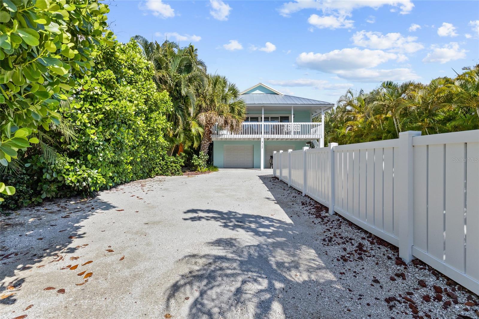 Spring Avenue. One of Anna Maria Island's most coveted addresses and this elevated pool home does it justice. Located on an island named one of America's prettiest cities by Forbes, this is the kind of home that turns heads before you even walk through the door.
Four-car garage plus additional off-street parking front and back means no compromises, whether you're hosting a full house or storing all the toys that come with island life. The open, airy layout with vaulted ceilings and warm wood accents gives you that treehouse-in-the-palms feeling the moment you arrive. Two bedrooms open directly to a private back deck. The pool is your backyard centerpiece.
Stroll to Pine Avenue for coffee, dinner, and boutique shopping. Catch the free island trolley at the corner. The Gulf and the Bay are both within easy reach and you are centered between them.
No HOA. Weekly rentals permitted. Turnkey furnished. Whether this becomes your primary island escape or a high-performing vacation rental, the bones, the location, and the lifestyle are already here waiting.