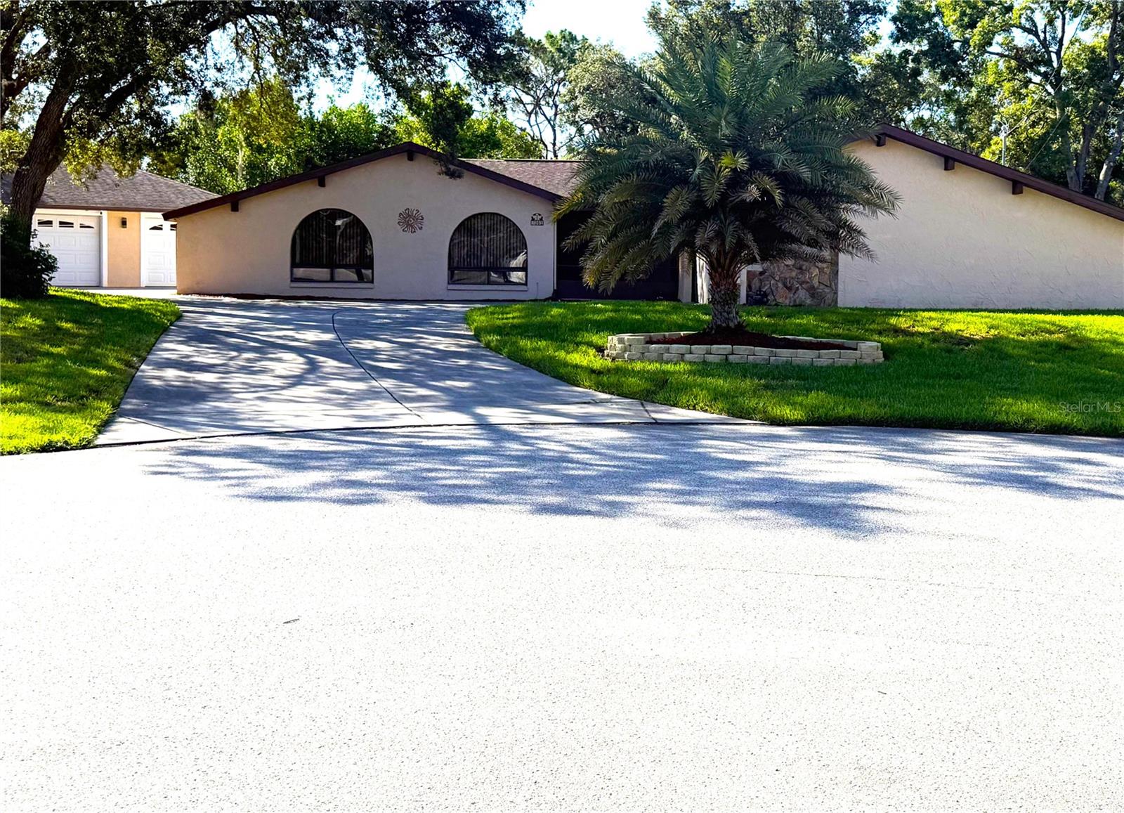 FINALLY!  THIS IS IT!  YOUR PRIVATE POOL PARADISE OASIS IS HERE!  Welcome to your updated, well-maintained, super clean home situated on a fully fenced, diamond-shaped, half-acre lot at the end of a cul-de-sac giving you that privacy you've been looking for.  This home has choose-your-color lighting inside and out.  Even the driveway has runway lighting.  The excellent quality updates in this beautiful home have been in all the right places.  The kitchen with granite counter tops, under cupboard lighting and glass tiles is the heart of this home.  The primary bedroom has a large walk-in closet and an updated ensuite with granite and a luxury rain shower.  Even more privacy is given on the other side of the home with 2 more bedrooms and another updated bathroom that has a granite vanity and a tub/shower combination.  The large screen-enclosed 30x15 pool is YOUR PARADISE OASIS with plenty of room for multiple seating areas as well as a gazebo.  Don’t forget about the incredible 24x36 detached 3-car garage.  The interior of the home and garages have been painted - even the garage floors.  There are many other reasons THIS HOME IS THE ONE.   The 2014 roof is hurricane strapped, which provides an insurance discount, the water heater is 2 years old, the pool heater was replaced, the pool pump is only 18 months old, and there is a well for irrigation.  The location is perfect for beach goers, shoppers, or adventures to other Florida destinations.  The remediation was completed in 2005 and the home is fully insurable.  Call for easy access.