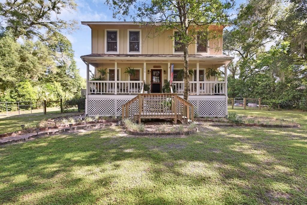 Escape to the peace and quiet of country living on this beautiful fully fenced 1-acre property with a charming farmhouse feel, tucked away just off West Taylor Road in DeLand. If you’ve been dreaming of wide-open spaces, room to grow, a space and a place to garden, and the freedom to enjoy your own private property, this is the home you’ve been waiting for.
This spacious two-story home offers four bedrooms, two and a half bathrooms, and a rare full basement—an exceptional feature that’s hard to find in Florida. Start your mornings on the inviting front porch with a cup of coffee while taking in the tranquil surroundings before stepping inside.
The thoughtfully designed floor plan features a formal dining room, a separate living room, and a warm, inviting family room that flows seamlessly into the eat-in area and country-style kitchen. Sliding glass doors open to a 16 x 40 backyard deck, creating the perfect setting for entertaining family and friends, weekend barbecues, or simply relaxing while overlooking your beautiful property.
With a full acre of land, there’s plenty of room to live the lifestyle you’ve always wanted. Let your chickens roam freely, bring your RV and boat, or build the workshop you’ve been dreaming about. The possibilities are endless.
Upstairs, you’ll find a spacious primary suite with sliding doors that step out onto a 8x 11 deck for your own private get away, along with three additional bedrooms, providing plenty of room for family and guests. Downstairs, the full basement offers abundant storage plus flexible space that can be used as a home office, game room, playroom, fitness area, guest quarters, or hobby room.
Enjoy the privacy and charm of country living while still being just minutes from shopping, dining, schools, and all that historic downtown DeLand has to offer. This unique property combines space, flexibility, and endless possibilities—making it the perfect place to call home.
There is a 100 gallon propane tank for the stove top, built in oven, dryer and water heater. ROOF 2017, HVAC 2018, Square D Panel Box.