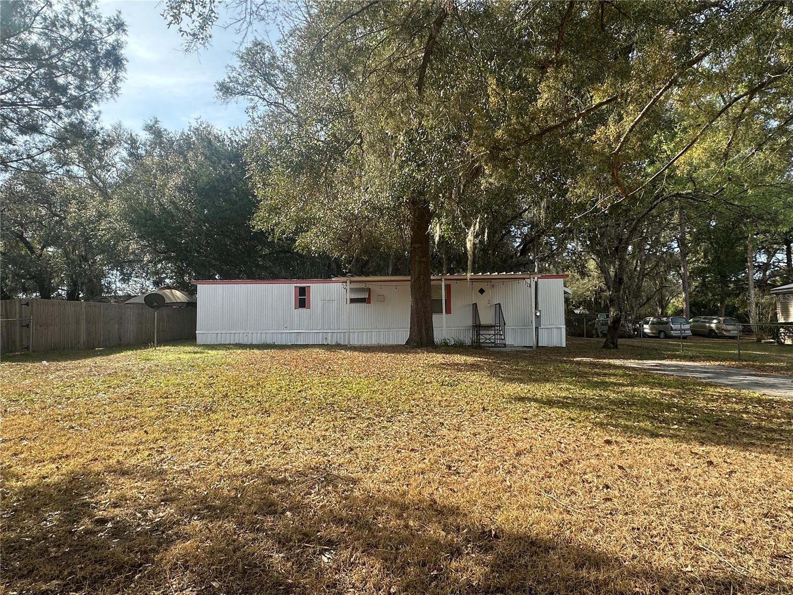 Come see the quiet and charming proeprty in Summerfield. Plenty of space in the the fenced front & back yards. A/C is two months old. 

This single-wide manufactured home sits on beautiful timbered lot and the layout is a nice split floor plan. Summerfield offers convenient access to the Villages & Ocala. Come enjoy the the beautiful scenery of old Florida!