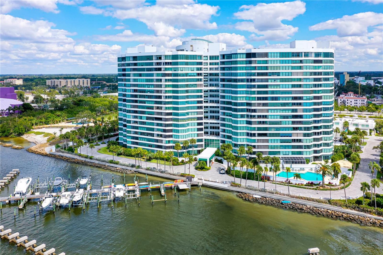 New price! New look! Indulge in premier bayfront living in this 10th-floor residence offering direct, unobstructed water and sunset views that will never be blocked. Boat slips are currently available for lease. Situated on a private, gated peninsula with 24-hour security, Condo on the Bay delivers an exclusive waterfront lifestyle walkable to downtown Sarasota and the Bay Park next door. From the extra-wide screened balcony, enjoy sweeping views of the bridge, boats, and coastal wildlife. Boat and kayak slips, a fishing pier, and immediate water access place the bay at your doorstep. Inside, the residence features a refined KitchenAid kitchen with granite countertops, a wine bar with cooler, full-size washer and dryer, and modern mechanical upgrades. The primary ensuite boasts endless water views and many custom closets. The spacious guest room, with a queen size murphy bed, also doubles as office space. The HOA fee covers all utilities except for electricity. Resort-style amenities include two heated pools, two new state-of-the-art fitness centers, tennis and pickleball courts, concierge service from 8–6 daily, and a full calendar of organized social activities. Next door is the Bay Park, a 52 acre paradise with walking trails, a beach, Performing Arts Center, a marina, concerts, kayak launch, snack bar, yoga, zumba and more. Downtown is down the street where you can choose from many restaurants, art galleries and events. Condo on the Bay offers a rare combination of unobstructed bay views, luxury amenities, walkable downtown access, and timeless waterfront elegance, this is an exceptional opportunity no buyer should pass up.