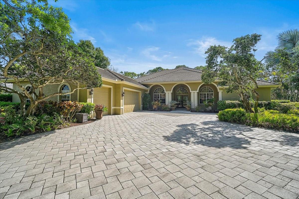 **IMPRESSIVE GOLF COURSE ESTATE IN THE HIGHLY SOUGHT-AFTER OAKS COUNTRY CLUB** Situated on an oversized 0.59-acre lot, this exceptional, meticulously-maintained residence features many upgrades and offers breathtaking garden and golf course views in a private, serene setting. Impressive curb appeal and beautifully manicured landscaping welcome you into a beautifully appointed home featuring 4 BEDROOMS plus a STUDY/DEN, 3 FULL and 1 HALF BATHS. Inside, you’ll find high ceilings, elegant crown molding, a cozy fireplace, plantation shutters, custom built-ins, and rich hardwood flooring throughout. The spacious kitchen is designed for both functionality and style, showcasing granite countertops and black stainless KitchenAid appliances. The expansive primary suite is a true retreat, complete with multiple walk-in closets, dual vanities, a soaking tub, and a custom-tiled shower. Enjoy Florida living at its finest on the screened lanai, featuring a heated pool and spa, travertine marble pool deck, and a large covered entertaining area—all overlooking tranquil golf course and garden views for ultimate privacy. Additional highlights include a 3-car garage and thoughtfully designed indoor-outdoor living spaces perfect for entertaining or relaxing.  THE OAKS is a distinguished, 24hr Guarded, Country Club Community which boasts many accolades including: Platinum Club of America, Emerald Club of the World, Elite Distinguished Club of the World and One of America’s Healthiest Clubs - where amenities include Three Restaurants, Ballroom, Two 18-hole championship GOLF courses, award-winning RACQUETS program with 12 Har-Tru Hydro-Grid TENNIS courts, 4 PICKLEBALL Courts, wonderful CROQUET facility, state-of-the-art FITNESS center and junior Olympic, heated community SWIMMING POOL, Bocce, Basketball Court, Playground and more! The Oaks is just minutes from nationally ranked Pine View School, the Legacy Bike Trail, area Beaches and all that Gulf Coast living has to offer. Membership is required and there is NO WAITLIST for GOLF or SOCIAL Membership. **Please Enjoy Viewing the 3D VIRTUAL TOUR**