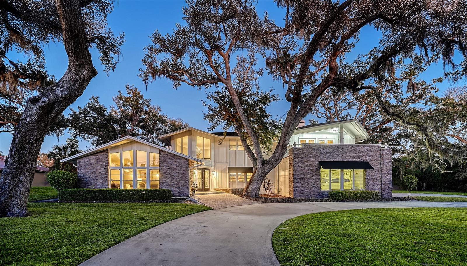 This home truly has it all - space, privacy, layout made for everyday living and entertaining! This is a rare opportunity to own a private, estate-sized home on over an acre in Sarasota—quietly tucked inside the gated community of Beneva Oaks at the end of a cul-de-sac. Set back from the road and surrounded by towering oak trees, the property offers a sense of peace, space, and privacy that makes it easy to feel at home the moment you arrive.

Built in 1980 by a professional builder for his own family, the home was intentionally created to fully enjoy the beauty, shade, and tranquility of the property—something that can be felt throughout the home. 

With more than 5,200 square feet of living space, the interior offers a versatile layout designed to bring people together while still allowing room to spread out. A welcoming foyer with a graceful spiral staircase sets the tone, opening to multiple living areas ideal for hosting holidays, celebrating milestones, or enjoying everyday moments with family. The formal dining room provides a beautiful setting for special gatherings, while the eat-in kitchen serves as the heart of the home, featuring double ovens, a separate Sub-Zero refrigerator and freezer, and views of the lush backyard.

The main-level primary suite offers a peaceful retreat, complete with a sitting area and a renovated spa-style bathroom with a freestanding soaking tub and custom walk-in shower. A first-floor office with custom built-ins and surround sound adds flexibility for working from home or creative use. 

Upstairs, four additional bedrooms, two full baths, and a flexible bonus space provide extra room for guests or hobbies. Three bedrooms open onto a screened balcony, while an additional open balcony invites quiet moments to unwind and take in the surrounding greenery.

Outdoor living is an extension of the home itself, with a screened lanai, resurfaced saltwater pool, Trex decking, and paver walkways creating a setting for both entertaining and everyday relaxation. The backyard is bordered by city-owned green space beyond the rear wall, enhancing privacy and reinforcing the feeling of a natural retreat.

Thoughtful updates throughout include new flooring, renovated bathrooms, four zoned air-conditioning systems, tankless water heaters, updated irrigation with a private well, a replaced septic system, a newer roof, and maintained fencing.  A circular driveway and three-car side-entry garage completes the property

Thoughtfully designed, surrounded by nature, and brimming with comfort…your new home awaits!