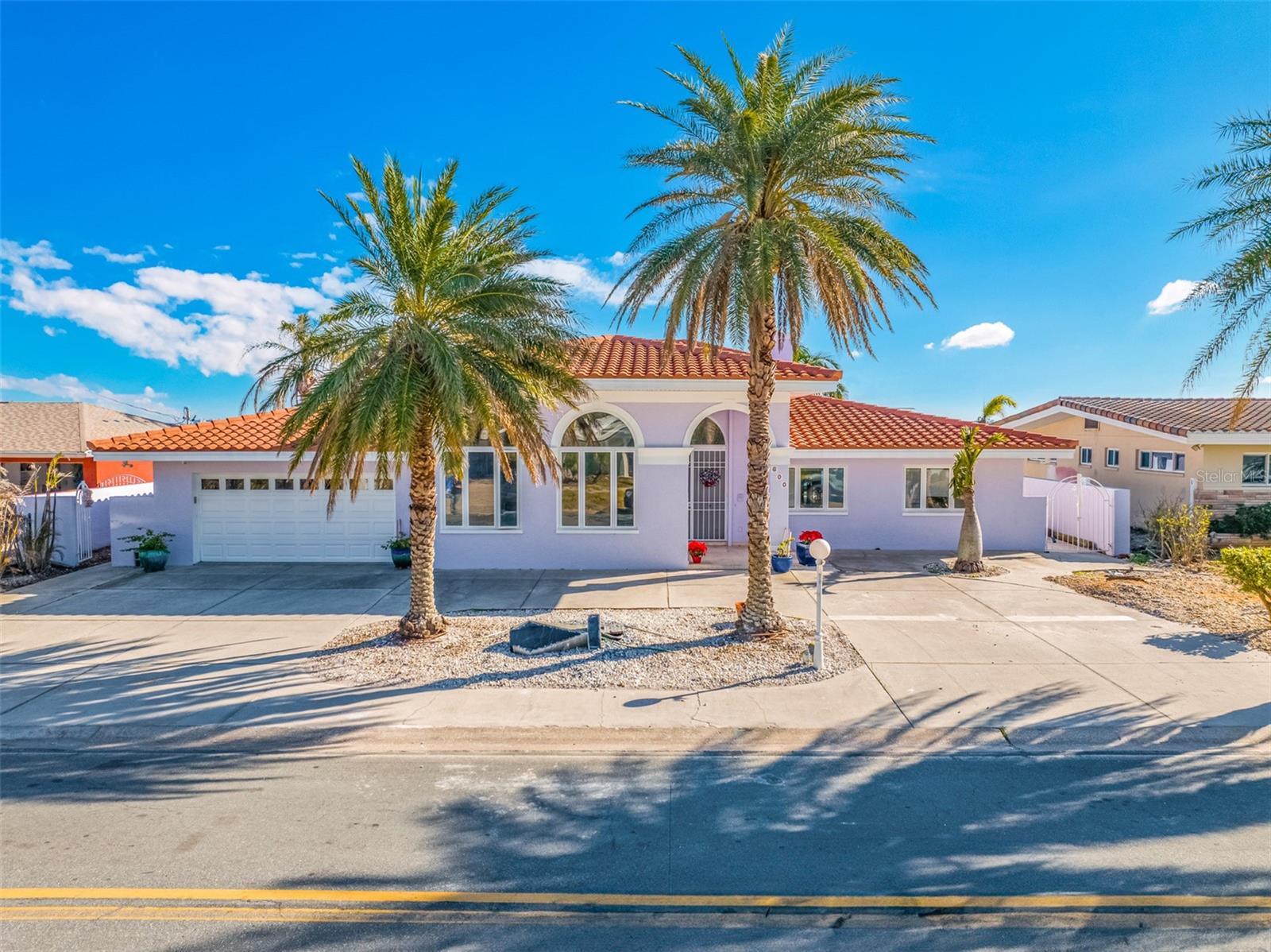 **Exquisite Waterfront Pool Property in Saint Pete Beach** Welcome to your dream home in the heart of Saint Pete Beach! This stunning waterfront property boasts 3,410 square feet of luxurious living space, offering 90 feet of water front and totally unobstructed views of the picturesque Boca Ciega Bay. Just a short stroll from the sandy shores, this residence is ideally located in the coveted Brightwater Beach Estates. As you step through the impressive and elegant entryway, you are greeted by a spacious billiard room perfect for entertaining, along with a large living area that seamlessly blends comfort and style. Beautiful waterviews everywhere you look.The thoughtfully designed split floor plan ensures privacy, with the magnificent master suite overlooking the tranquil waters and inviting pool. With four generously sized bedrooms and 4 baths, this home provides ample space for family and guests. Experience the best of coastal living with stunning sunsets, serene water views, and the vibrant lifestyle of Saint Pete Beach at your doorstep. Don’t miss this rare opportunity to own a piece of paradise! In addition to the main house, discover your private oasis in this exceptional upstairs ADU, where natural light floods in through multiple skylights, creating a bright and inviting atmosphere. This unique guest living space features a full bathroom and a well-appointed kitchen complete with a refrigerator and microwave, making it perfect for family or visitors. Step outside onto one of the two expansive balconies, where you'll be captivated by incredible water views that enhance the serene Florida lifestyle. Every corner of this retreat embodies the lush, tropical ambiance that makes living here truly special. This ADU remained untouched by Hurricane Helene, offering peace of mind and a pristine living environment. While the main house experienced some impact, it has been professionally remediated and is now ready for its new owner to infuse it with personal style and elegance. Don’t miss this opportunity to own a piece of paradise, where luxury and tranquility meet!
