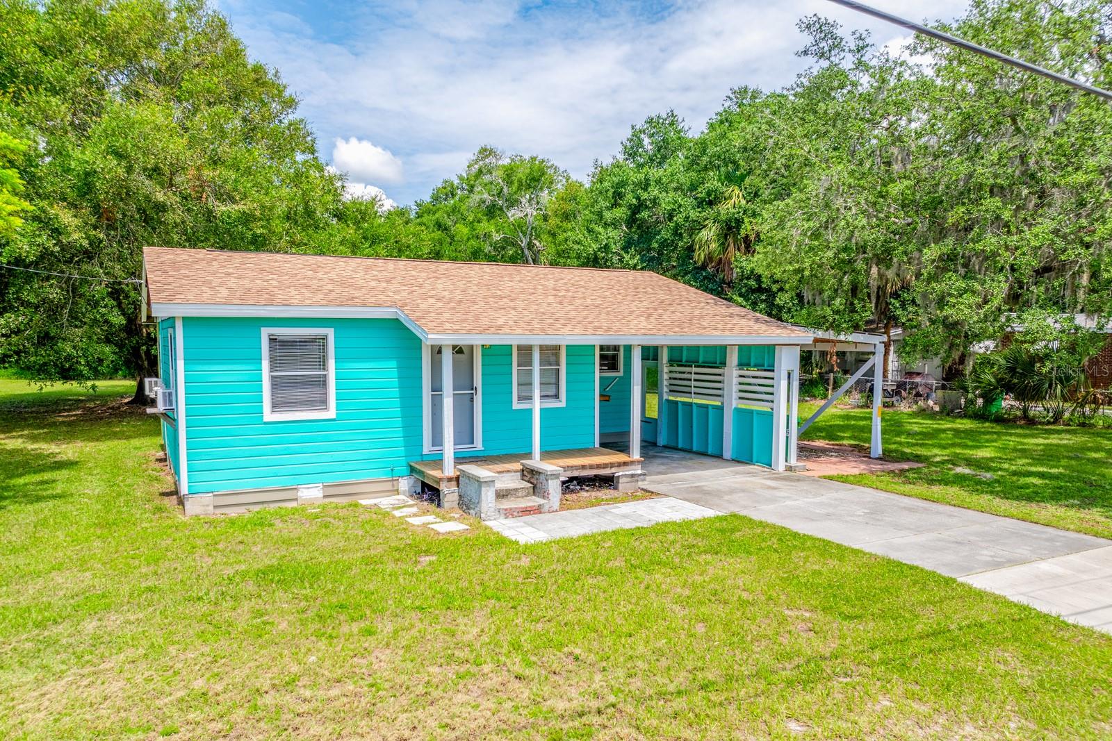 Welcome home to this charming 2-bedroom, 1-bath residence situated on a spacious 0.62-acre lot in Mims. Recent updates include a roof installed in 2021, fresh interior paint, and updated laminate flooring, making this home move-in ready. Step outside and enjoy the large backyard featuring a deck that's perfect for relaxing, entertaining, or enjoying your morning coffee. The property also includes a storage shed for your tools and outdoor equipment, a cozy fire pit area for gathering with family and friends, and a one-car carport for added convenience. With over half an acre of land, there's plenty of room for gardening, pets, outdoor activities, or simply enjoying the extra space and privacy. Conveniently located with easy access to Titusville, the Space Coast, and major roadways, this property offers the perfect balance of country-style living while remaining close to everyday amenities, parks, wildlife preserves, and outdoor recreation opportunities. USDA financing may be available for qualified buyers, making homeownership even more affordable. Don't miss your chance to own this affordable piece of Florida living!