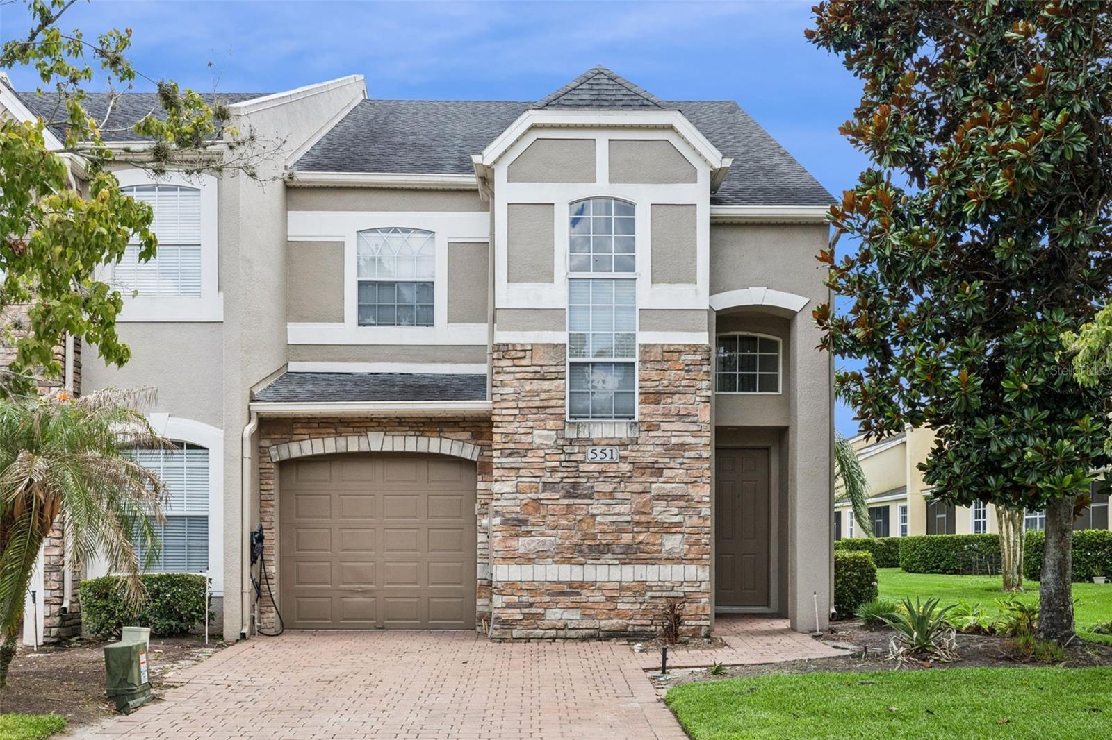 Rare opportunity to own a Toll Brothers-built waterfront corner-unit townhome in the gated Woodland Terrace community. Designed for both comfort and style, this exceptional residence offers a sought-after first-floor primary suite, soaring two-story ceilings, an open-concept layout, and a spacious loft perfect for flexible living. The premium corner-unit location maximizes natural light while providing added privacy, and the tranquil water views create a relaxing backdrop throughout the home. Recent improvements include new vinyl flooring throughout, a newer A/C condenser (2021), refrigerator (2021), and microwave (2021). Residents enjoy a true low-maintenance lifestyle with HOA-covered roof replacement, exterior maintenance, landscaping, and common area upkeep. Nestled within the highly sought-after Timber Springs master-planned community, residents enjoy beautiful tree-lined streets, a quiet and peaceful atmosphere, and exceptional community amenities. Woodland Terrace features gated access and a community pool just steps away, while Timber Springs also offers a nearby park, playground, and tennis courts. Conveniently located minutes from shopping, dining, UCF, Waterford Lakes Town Center, major employers, and everyday conveniences, this home provides easy access to SR 50, 408, 417, and 528, allowing for convenient travel to Downtown Orlando, Lake Nona, Orlando International Airport, and Orlando's world-famous attractions. Don't miss this rare opportunity to own one of the community's most desirable floor plans with premium water views and the renowned quality of Toll Brothers construction.
