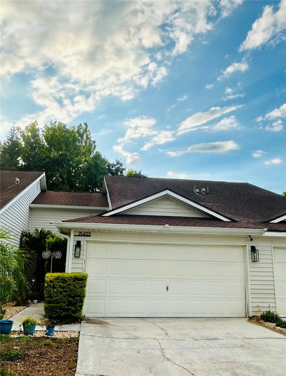 Welcome to this beautiful townhome in the highly desirable Lake Heron community. Featuring 3 bedrooms, 2.5 bathrooms, and an attached two-car garage, this home offers comfort, space, and convenience for your family. The primary suite is conveniently located on the first floor, along with the spacious living and dining areas. The kitchen offers room for a breakfast nook and is conveniently located next to the laundry area. Upstairs, you’ll find a versatile loft that can be used as a family room, TV lounge, home office, or whatever best suits your needs. This level also includes two additional bedrooms and a full bathroom. Step outside to enjoy the private screened patio overlooking a large green space—perfect for relaxing or spending time with family. Even better, the lawn maintenance, along with the upkeep of all common areas, is included through the homeowners association. As a resident, you’ll also enjoy complimentary access to the community amenities, including a clubhouse, swimming pool, and sports courts. Did we mention that Lake Heron is a gated community? It offers the added peace of mind and security every family appreciates.Schedule your private showing today! This wonderful home will be available for move-in beginning in early August.
