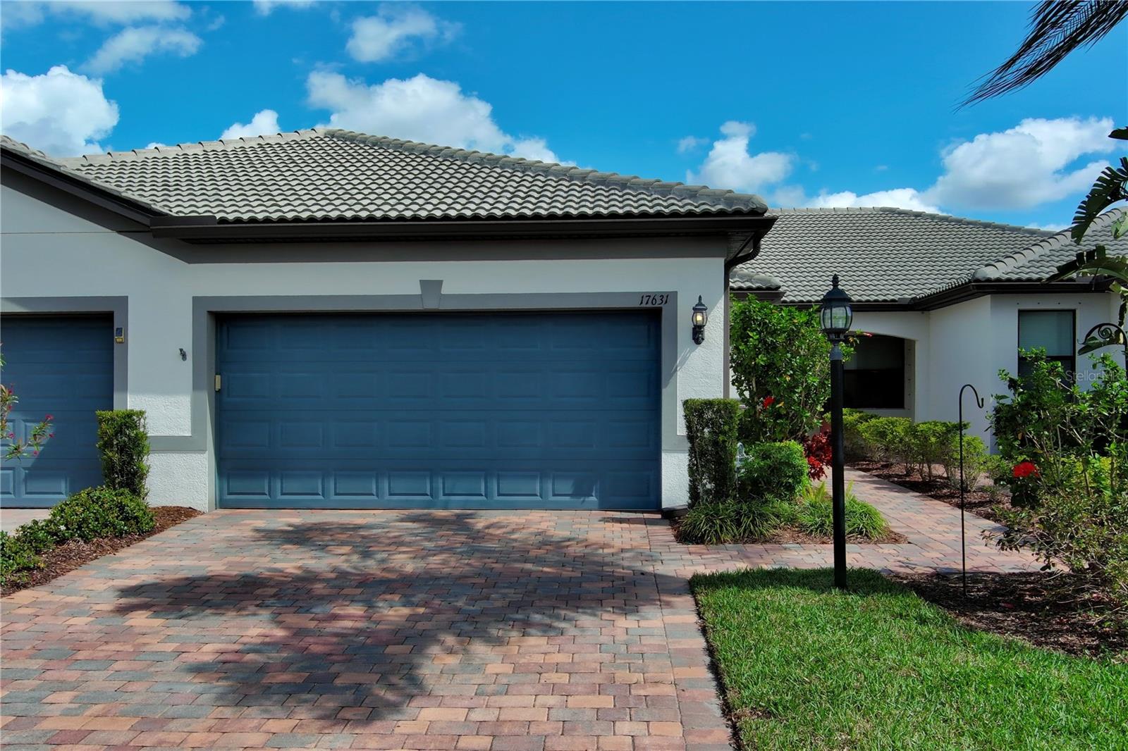 Live like you’re on vacation every day in this beautifully designed villa in the highly sought-after Del Webb community of Lakewood Ranch. This thoughtfully laid out home features 2 bedrooms plus a den, offering flexible space for a home office, hobby room, or guest area. The open floor plan is complemented by solid surface countertops, abundant natural light, and comfortable living spaces designed for easy Florida living.

Enjoy outdoor relaxation on the extended brick paver lanai, complete with storm screen protection, and take in the peaceful water view, a perfect setting for morning coffee or evening sunsets. The two-car garage features durable epoxy-finished floors, adding both style and practicality. Ideally located just a short distance from Del Webb’s world class amenities, residents enjoy a 21,000-square-foot clubhouse, state-of-the-art fitness center, movement studio, heated resort pool and spa, tennis, pickleball, and bocce courts, scenic walking trails and waterfront dining at The Lake House. A full-time lifestyle director curates an exciting calendar of events, clubs and activities, ensuring there’s always something to enjoy. Just minutes from world-class beaches, fine dining, Lakewood Ranch Main Street, The Waterside Shops and downtown Sarasota, this villa is more than a home, it’s a lifestyle. Experience it for yourself and schedule your private showing today!