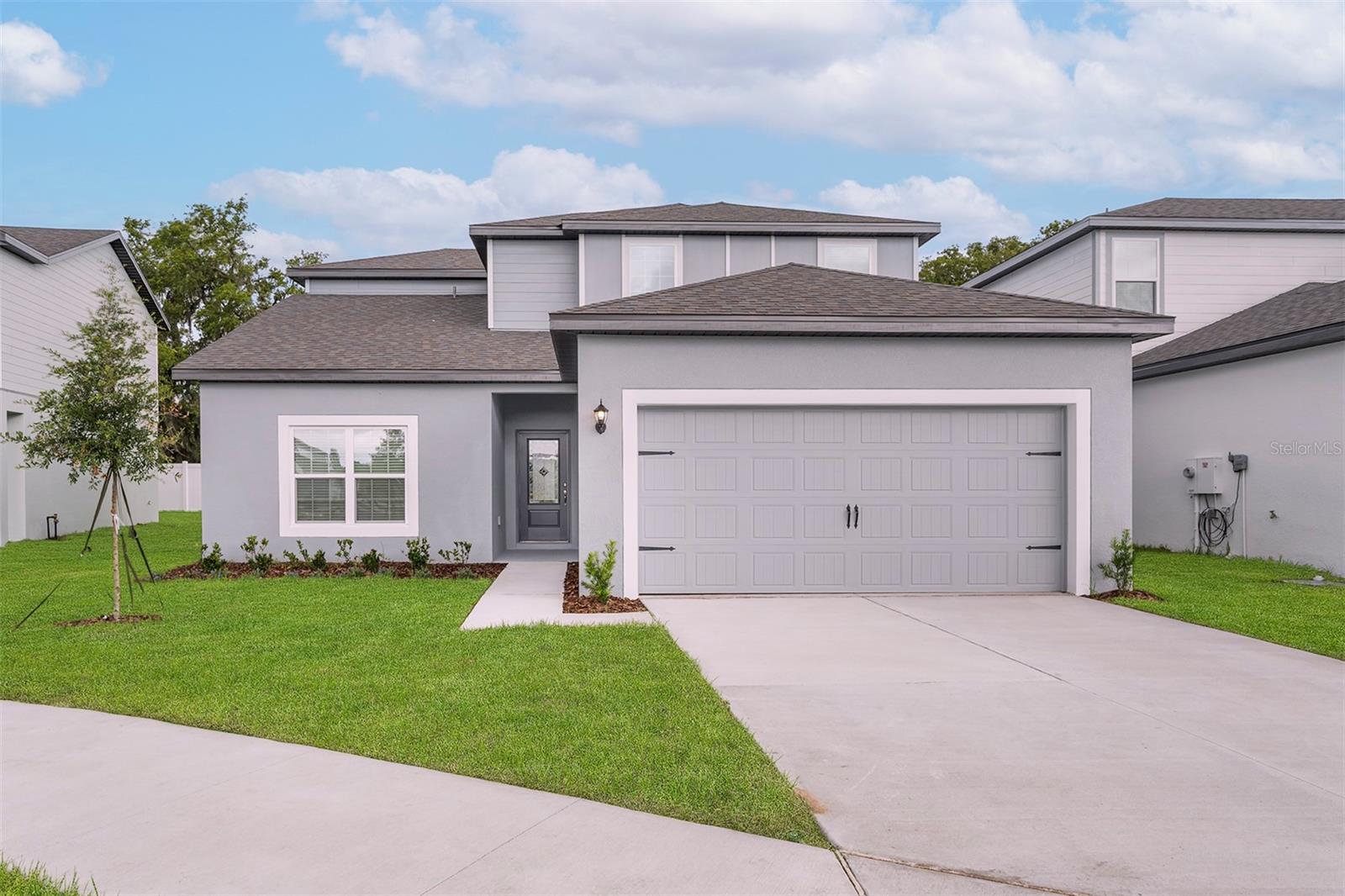 Pre-Construction. To be built. Welcome to the Parc floor plan, a spacious and thoughtfully designed 4-bedroom, 2.5-bathroom two-story home located in the desirable Tula Parc community. This home offers a functional layout with modern finishes, perfect for both everyday living and entertaining.

From the moment you arrive, the professionally landscaped front yard and inviting entry lead you into a bright interior featuring a large family room, a separate dining area, and a chef-ready kitchen. The kitchen is equipped with granite countertops, stainless steel Whirlpool appliances (including a refrigerator), 36-inch upper wood cabinets with crown molding, Moen faucets, and LED flush-mount Energy Star lighting, creating a stylish and efficient space.

Upstairs, you’ll find four generously sized bedrooms, each with its own walk-in closet, providing ample storage for everyone. The private master suite offers a relaxing retreat with a spacious bathroom and an oversized walk-in closet.

Additional upgrades include double-pane low-E vinyl windows, programmable thermostats, designer coach lighting, and a Wi-Fi-enabled garage door opener, all included at no extra cost.

Located in Tula Parc, residents enjoy close proximity to Little Lake Harris, offering easy access to outdoor recreation such as boating, fishing, and kayaking. The community is conveniently located near local dining, shopping, and everyday essentials while still providing a peaceful neighborhood setting.

Don’t miss your opportunity to own this beautifully upgraded home—schedule your private tour of the Parc today!