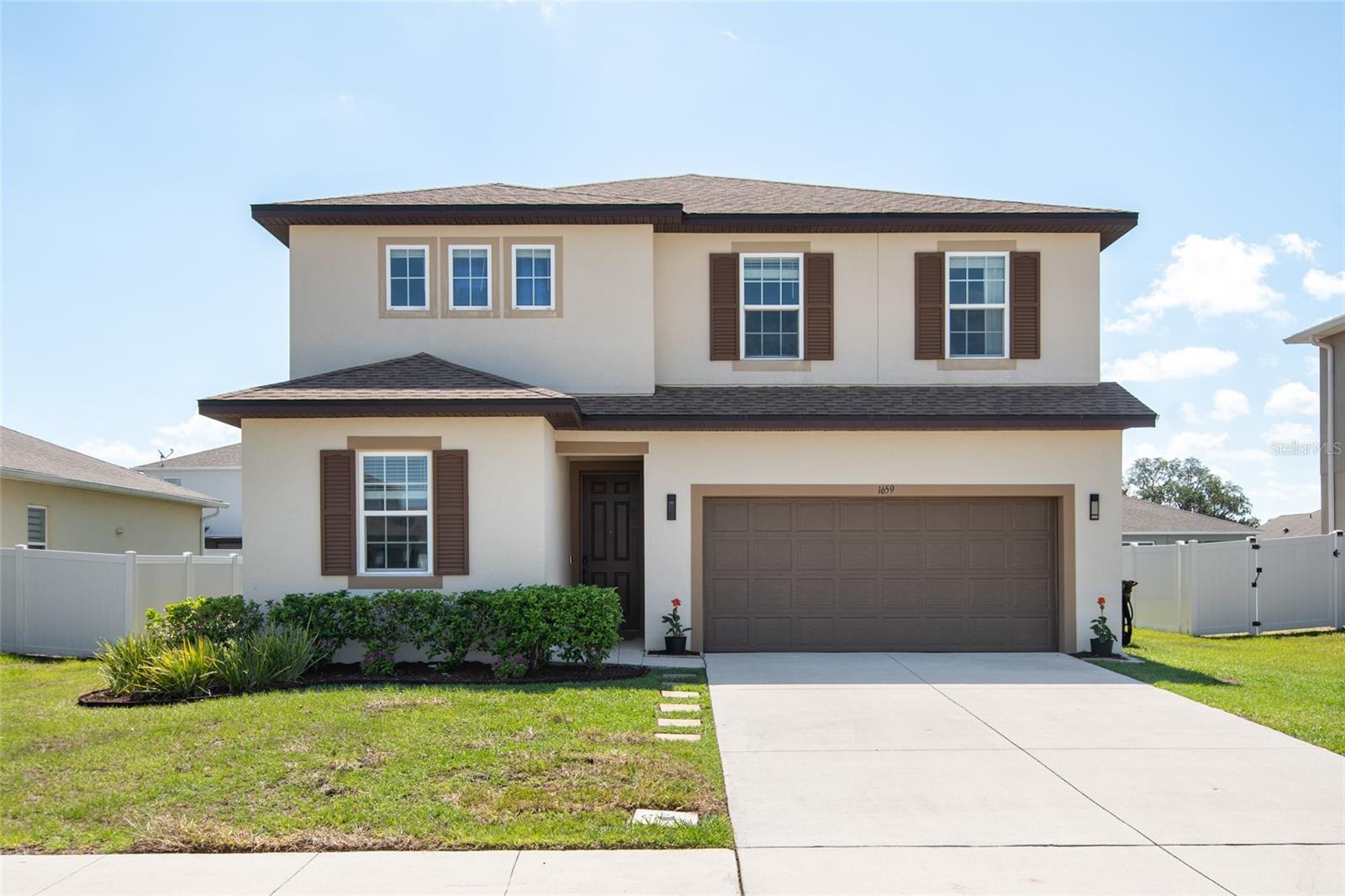 Virtually Staged. Welcome Home! The one you've been waiting for is finally here! This move-in ready single-family home is located in the desirable Estates of Westerly in St. Cloud, just minutes from Lake Nona Medical City and all that Central Florida has to offer.
Featuring 5 bedrooms, 3 full bathrooms, a 2-car garage, and a large oversized homesite, this home offers the perfect combination of space, functionality, and comfort. As you enter, you're welcomed by a spacious foyer and beautiful flooring throughout, including tile on the first floor and luxury vinyl plank upstairs.
Just off the entryway, you'll find a convenient first-floor guest suite complete with a full bathroom just outside the bedroom, making it ideal for visitors, multigenerational living, or a private home office. 
The open-concept kitchen, family room, and dining area create the perfect setting for entertaining and everyday living. Your kitchen is thoughtfully designed with granite countertops, stainless steel appliances, a large center island featuring a single-basin stainless steel sink, cabinetry with soft-close features and custom organizational storage solutions, and a spacious closet pantry.
Adjacent to the kitchen is the dedicated dining space, perfectly positioned for hosting holiday gatherings, dinner parties, and special celebrations with family and friends.
The spacious great room serves as the heart of the home, offering the ideal place to relax, unwind, and create lasting memories. Enjoy seamless indoor-outdoor living with sliding glass doors that open from the kitchen area to a covered patio, providing the perfect space to enjoy Florida's beautiful weather year-round.
Upstairs, you'll appreciate the large walk-in laundry room complete with additional storage space. Down the hall are three generously sized secondary bedrooms and a full bathroom, offering plenty of room for family and guests.
Privately situated at the end of the hallway is the expansive primary suite, your own personal retreat. The luxurious en-suite bathroom features dual sinks, an upgraded drawer stack for additional storage, a walk-in shower with a frameless glass enclosure, beautiful 12x24 tile surround, and an oversized walk-in closet designed to accommodate all your storage needs.
Additional highlights include a two-car garage equipped with Gladiator storage racks for maximum organization and a full driveway for added convenience.
Perfectly positioned within the community, you'll enjoy a large green space and community pool just steps from your front door, making it easy to embrace the active and connected lifestyle that Estates of Westerly has to offer. Mins to shopping, dining, highways, Lake Nona's Medical City, and Orlando International Airport. New High School opening August 2026 and a New Walmart Shopping Center Coming Soon.