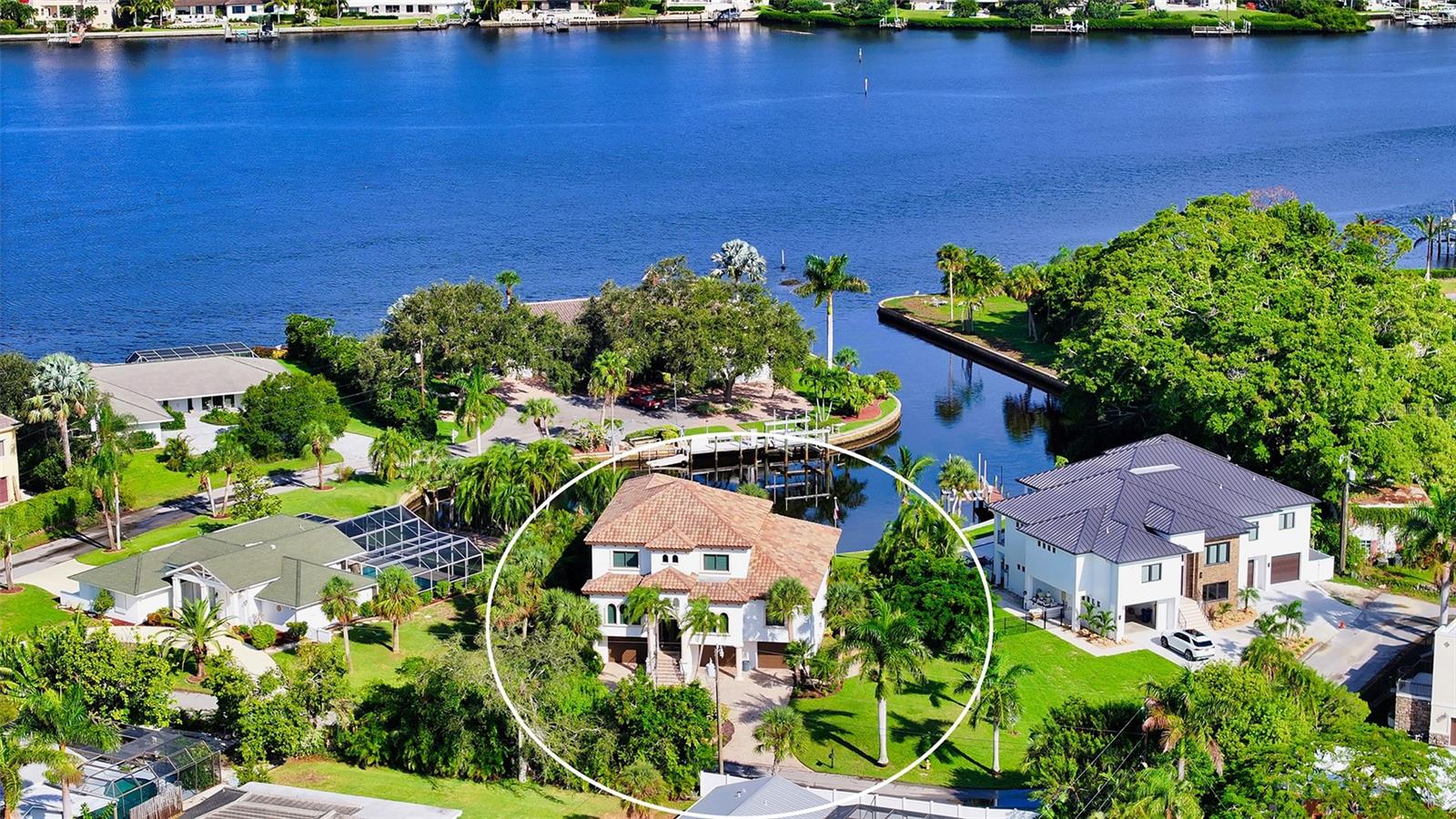 Welcome to paradise! This remarkable waterfront residence offers the epitome of luxurious Florida living with WATER VIEWS in EVERY ROOM. Boasting 3 bedrooms, 3 bathrooms, plus a den, this home is a masterpiece of modern design and functionality with amazing water views from near every room in the home and is perfectly situated on a Dona Bay basin with direct access to the ICW with no bridges!
Situated on a prime waterfront lot with an impressive 90 feet of Intracoastal Waterway (ICW) frontage, with a 10,000-pound boat lift and dock. Home was meticulously constructed in 2012, surpassing current hurricane code requirements ensuring both durability and peace of mind.
Step inside to discover a host of upscale features, including a dual-zone AC/heat system, instant hot water, two electrical panels, and a whole-house generator for added convenience and security. The tile roof, Sonos Sound System, and PGT Thermal Hurricane Impact resistant windows and doors exemplify the home's commitment to quality.
Elegant details such as crown molding, 8-foot doors, plantation shutters, and 16x16 travertine tile are found throughout. The main living area showcases a chef's dream kitchen with 2-islands, granite countertops, top-of-the-line appliances, including a six-burner gas stove, and a massive pantry with a second refrigerator. Maple cabinets with under-mounted lighting add to the kitchen's allure. The dining area seamlessly opens to the lanai through a 90-degree slider, creating a perfect indoor-outdoor flow with a full ODK.
The great room impresses with soaring 20-foot ceilings, while a large office with French doors offers a quiet workspace. The master bedroom features two walk-in closets, a storage closet- but built to allow for an elevator addition, double tray ceiling and an ensuite bathroom with his and her vanities featuring granite countertops, step-ins shower with 2-showerheads, and a garden tub. A huge laundry room features built-in cabinets with undermounted lighting, and granite countertops. A full guest bath boasts a step-in shower with a glass enclosure and stylish vanity and sink.
Level three showcases fossilized bamboo flooring and two spacious bedrooms, 1-with a walk-in closet and the other with an armoire closet. Bedroom 3 and the loft area share a Jack and Jill bathroom with a separate water closet. The loft area provides a wet bar area with a fridge, ice maker, microwave, and sink, all surrounded by solid cabinets and can easily be converted into a fourth bedroom if desired.  
The ground level of this home offers endless possibilities, featuring an oversized 3-plus car garage and two defined areas, currently used for storage. This area can be great for a teenager, or for multi-generational living. Plumbing has been roughed-in for an added bathroom which could double as a cabana bath or ensuite should an area be made into another bedroom. The second storage area can be converted into a playroom, theater room, home gym, or – the possibilities are endless! Both areas have amazing water views with sliders to the pool area.
Step outside to experience the expansive pool area, complete with the option to add an additional ODK. The heated pool is equipped with alarms on the doors for added safety. The wrought iron fencing surrounds the property, providing both security and style. Don't miss out on this exceptional home!