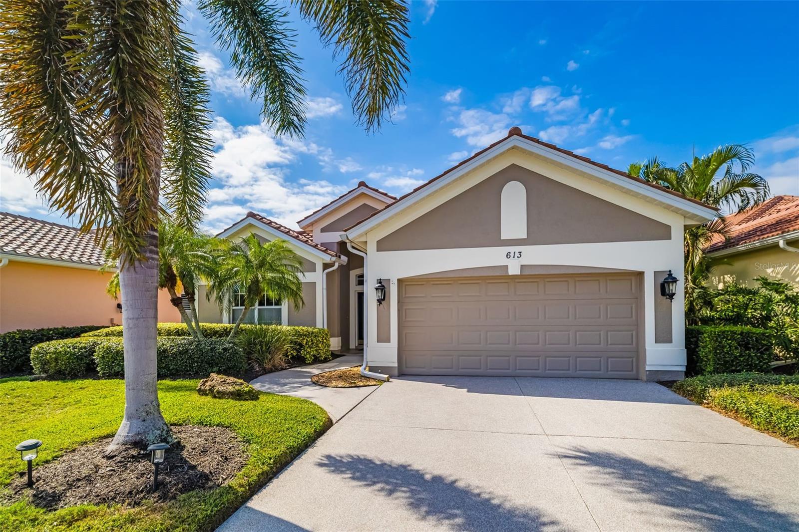 A true lock and go home with major new infrastructure already done. Located in the maintenance free section of Sawgrass, this updated pool home offers private golf views, no homes across the street, and a long list of recent improvements — including a NEW TILE ROOF (2025), resurfaced pool, new heater, epoxy finishes throughout, fresh interior paint, and lush landscaping. Light, bright interiors feature high ceilings, crown molding, ceramic tile floors, and a great room that opens fully to the lanai. The kitchen includes stainless appliances, breakfast bar, pantry, and an aquarium window. The primary suite offers a bay window, walk in closet, dual sinks, walk in shower, garden tub, and direct pool access. Two guest bedrooms enjoy their own private wing. Outside, relax by your private pool with bronze screening, accordion hurricane protection, and an electric retractable awning. Low HOA fees cover yard care, irrigation, community pool/spa, fitness center, clubhouse, tennis, and pickleball. Minutes to beaches, Legacy Trail, downtown Venice, Wellen Park, and Sarasota. Why wait, preview today!