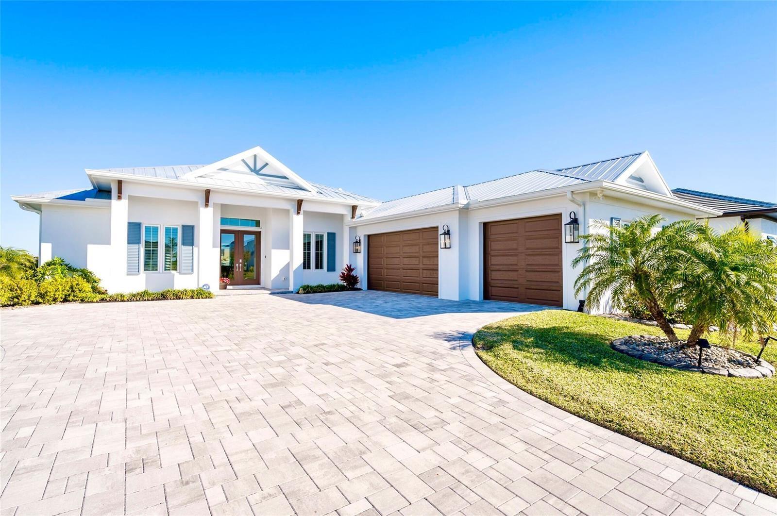 Pre-Construction. To be built. Build the home you’ve always envisioned in one of Florida’s premier luxury waterfront gated communities. Photos shown are of a sample home to illustrate the quality and possibilities of what could be built on this exceptional lot. This is one of the last remaining lots available in the exclusive waterfront boating community of Water's Edge in Sanctuary Cove. Pick any builder you like and custom build the home of your dreams in this serene atmosphere surrounded by lush landscapes and charming wildlife. Take a short stroll over to the south marina where boat slips are available for purchase and can accommodate up to a 35' boat.  Live like you are on permanent vacation with access to the 8,600 square foot resort center featuring a fitness center, game room, activity room and resort style waterfront pool & spa. Private riverfront Beach w/kayaking, paddle boarding, picnic & grill area. Water’s Edge is in a perfect location for commuters and boaters alike! This secure gated community is only 4.5 miles to downtown Bradenton, 19 miles to St. Petersburg and 14 miles to Sarasota Airport. All home plans must go through ARC approval and you will see a diverse offering of home styles from coastal chic to classic mediterranean and stylish modern.  Minimum home size requirement of 3,000 sq. ft. under air.  Conveniently located near shopping, dining, and entertainment options, you'll enjoy the best of both worlds—peaceful riverfront living and easy access to local amenities. Don’t miss the boat on this incredible opportunity to create your waterfront oasis! Please note - photos are of a similar model for representation purposes only. Lot offered at $325,000.