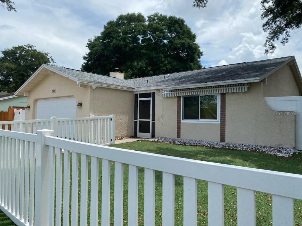 Wow Honey Stop the Car! a unique opportunity to own a stabilized 3 unit multi family home in the rapidly growing Palm Harbor area with substantial room for growth. With proximity to both Tarpon Springs beaches and Dunedin Beaches, centrally located to good schools and shopping. Owner spent over 80k in cap ex including new fencing, bathrooms, flooring, appliances, roof, energy efficient windows and a new HVAC installed  June 2026. Roof 2020. Water Heater 2018. 2 units are efficiency units and are producing great rent at $ 85.00 per night or and average of $1800 per month per efficiency unit.. This would give you a combined total of $3,600 for the 2 efficiencies. per month or higher during high usage months- seasonally January through May. Should someone wish to live and homestead the 2/2 this would help pay the mortgage! If you live on the property, you can avoid needing a short-term rental license. Another choice to rent out the 2/2 at $200 a night would bring in $2300 a month at 50% occupancy  remembering  that at high season the 2/2 has brought in $5,000 a month. NON FLOOD ZONE !!! NON EVACUATION ZONE !!!!