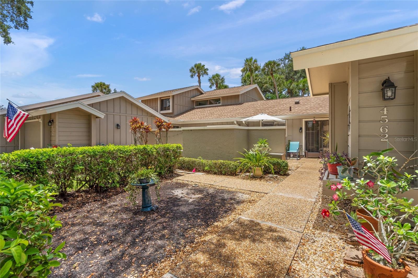 Extremely well maintained and improved split plan 2 bedroom, 2 bath villa in active plus 55 community in gated Bent Tree Hammocks II. The property features  a comfortable living area with wood burning fireplace, engineered hardwood floors, 2 car garage, indoor utility, new roof 2021, new garage door 2021,  new  air conditioning 2022,new water heater 2025.  Hammocks II is located in a maturely landscaped area of Bent Tree and features a heated pool, gate protection & easy access to all Sarasota amenities. This is truly the answer to your care free living search.