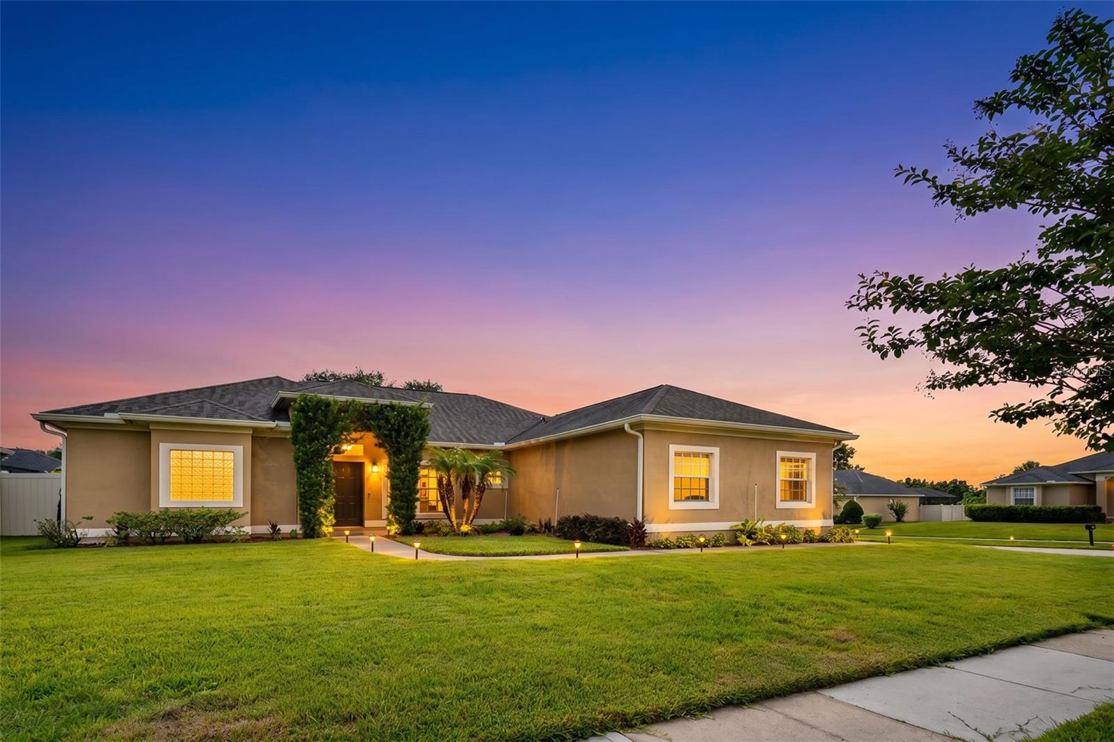 Welcome to 1643 Shonnora Drive — a meticulously maintained 3-bedroom, 2-bathroom single-story home inside Falcon Pointe, one of Gotha's most sought-after private gated communities. With only 95 homes behind the gate, this quiet enclave delivers the exclusivity and tranquility of upscale living at an HOA of just $76 a month. Curb appeal here is exceptional. A lush, well-manicured front lawn framed by colorful tropical landscaping and a curved walkway leads to the front entry, where signature glass block windows give the home a timeless architectural character. 
The white vinyl fence (2016), fresh sod, and maintained grounds with active pest and weed control complete a picture perfect exterior. Step inside and the space immediately impresses. Soaring cathedral ceilings create a bright, airy, and expansive feel throughout. The split floor plan places the primary suite privately on the west wing, completely separated from the two secondary bedrooms — ideal for families, guests, or anyone who values privacy. The open-concept flow connects the formal living room and dining area to the kitchen and family room in a layout that works beautifully for both everyday life and entertaining. Large-format tile runs throughout all living areas. Custom plantation shutters on the family room windows provide both refined style and perfect light control. New custom blinds installed in 2025 complete the window treatments throughout. The kitchen features warm maple cabinetry with generous storage, stainless steel appliances in excellent condition, ample counter space, a sunny breakfast nook, and a peninsula that creates an easy flow for entertaining. French doors in the family room open directly to the rear yard — perfect for Florida indoor-outdoor living. The primary suite is a true retreat. Spacious and privately positioned, it features a walk-in closet with custom built-in organization (2024) and a spa-quality ensuite bathroom renovated in 2024. The primary bath showcases a double vanity, an oversized frameless walk-in glass shower with premium large-format designer tile, a separate garden soaking tub, and beautiful glass block windows that fill the space with soft natural light — finished to a level well above what this price range typically delivers. The guest bathroom was also fully upgraded in 2024, featuring a frameless glass walk-in shower and premium tile work. Both bathrooms are presented in move-in showroom condition. 
Complete Update & Improvement History: New roof & Rain gutters (2018) Primary bathroom full renovation & Guest bathroom full renovation (2024) Custom built-in closets & Smart irrigation system (2024) New washer (2025) New custom blinds throughout (2025) Custom plantation shutters on family room windows. Stainless steel appliances — all in excellent condition White vinyl fence (2016) New sod front and backyard (2016) with active pest and weed control service. New patio tile (2016) Fresh interior paint (2015) Fresh exterior paint (2017). Zoned for top-rated Orange County schools: Thornebrooke Elementary, Gotha Middle, and Olympia High School. 
Located minutes from Historic Downtown Winter Garden, Windermere, SR-408, Florida Turnpike, I-4, Winter Garden Village shopping, restaurants, hospitals, and all of Central Florida's attractions. Easy commute to downtown Orlando, the theme park corridor, and major employment centers throughout the metro. 
Falcon Pointe listings are rare and move fast. Schedule your private showing today!