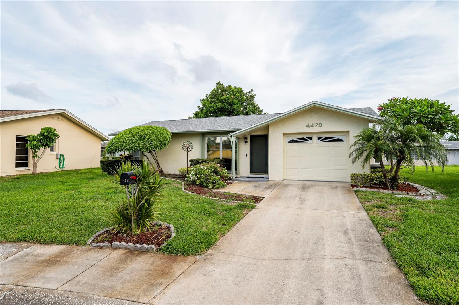 Welcome to 4479 Michigan Lane in Clearwater, Florida! This charming 2-bedroom, 1-bath home is located in a sought-after 55+ community offering an active and social lifestyle. Ideally situated just steps from the community clubhouse, sparkling pool, and shuffleboard courts, you'll enjoy the convenience of walking only a few feet to your favorite amenities. The clubhouse is a wonderful gathering place where residents enjoy card games, Mah Jongg, social events, and connecting with friends and neighbors. The home features important updates, including a new roof installed in 2020 and an air conditioning system replaced in 2014, providing added peace of mind. Whether you're looking for a seasonal retreat or year-round Florida living, this well-maintained home offers comfort, convenience, and a welcoming community atmosphere. Conveniently located near shopping, dining, airports, and the beautiful Gulf Coast beaches, and a 10 minute ride to the St Pete Clearwater International Airport.   This is your opportunity to enjoy the best of Clearwater's active adult lifestyle.