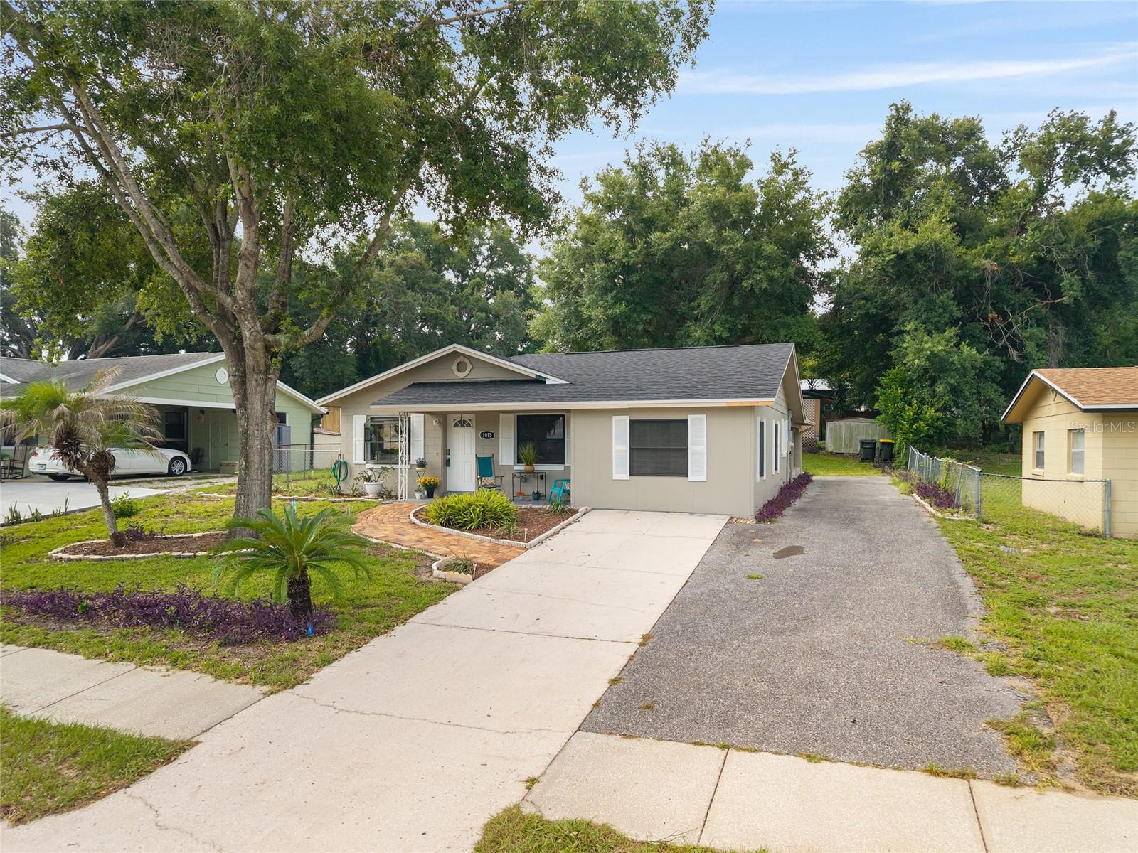 LOCATION, LOCATION, LOCATION! Discover the charm of downtown Clermont in this beautifully renovated 3-bedroom, 1-bath cottage home, featuring a bonus room perfect for Game Day, a home office, a playroom, or a hobby space.

Love all the festivals, waterfront events, and dining downtown, but hate searching for parking?  Imagine simply walking to it all!  Stroll to Clermont's popular restaurants, charming cafés, wine bar, breweries, waterfront parks, Sunday Farmers Market, and the exciting First Friday food truck events. From Peruvian and Caribbean cuisine to steakhouses, pizza, burgers, wings, and more, you'll have an incredible variety of dining just minutes from your front door.  You'll even enjoy a peek-a-boo view of Lake Minneola from the front yard.

Relax with your morning coffee on the inviting front porch or unwind in the evening on the covered back porch.

The major investments have already been completed, giving you peace of mind for years to come. Recent improvements include a NEW ROOF, NEW A/C, NEW HOT WATER HEATER, UPDATED PLUMBING (REPIPED), UPDATED ELECTRICAL SYSTEM with the capacity to add an EV charging outlet, NEW FLOORING, knockdown ceilings, and fresh, crisp white paint throughout the interior. The popcorn ceilings are gone! You'll also appreciate the convenience of the indoor laundry room and the oversized family room, which offers flexible space for entertaining, movie nights, or everyday living.

Looking ahead? The generous backyard provides excellent potential for a future addition.  Whether you've dreamed of creating a spacious primary suite with a private bath or expanding the home's footprint, this property offers room to bring your vision to life.

The kitchen and bathroom are ready for your personal touch, allowing you to customize them to match your style and taste.  The costly renovations have already been completed—now simply choose your favorite finishes and create the home you've always envisioned.

Living in downtown Clermont means embracing an active Florida lifestyle with a public boat ramp, miles of scenic walking and biking trails, beautiful lakefront parks, boutique shopping, locally owned restaurants, and year-round community events just outside your door.

Whether you're searching for your first home, a charming place to downsize, a vacation retreat, or an investment property, this Historic Downtown Clermont gem offers exceptional value, modern updates, and endless possibilities.

Renovated homes in Historic Downtown Clermont rarely stay on the market for long.  Schedule your private showing today and experience everything this exceptional home—and this incredible location—has to offer!