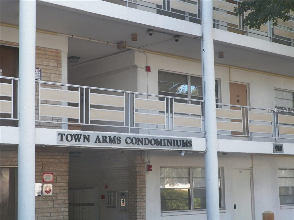 This top floor 2 BR/1 BA condo in the Town Arms Condominiums has a large living room, bonus room off the kitchen. The kitchen has a gas cooktop Kitchen and bathroom with tile floor and Laminate flooring in living room, dining room and bedrooms. The building has an ELEVATOR, security cameras and a community laundry room. This complex is close to everything: shopping, banks, dining, beach is 10 minutes away, parks, bike trails and the LARGO MEDICAL CENTER. Monthly fees include water, sewer, trash, gas (for kitchen cooktop,
heating and cooling and community water heater). This property can also be rented as there is no minimum ownership period requirement. Enclosed Florida room can be used as an office, media room or playroom. The laundry facility is located on the second level next to the elevator. This is not an age restricted community. Sorry pets are not allowed.