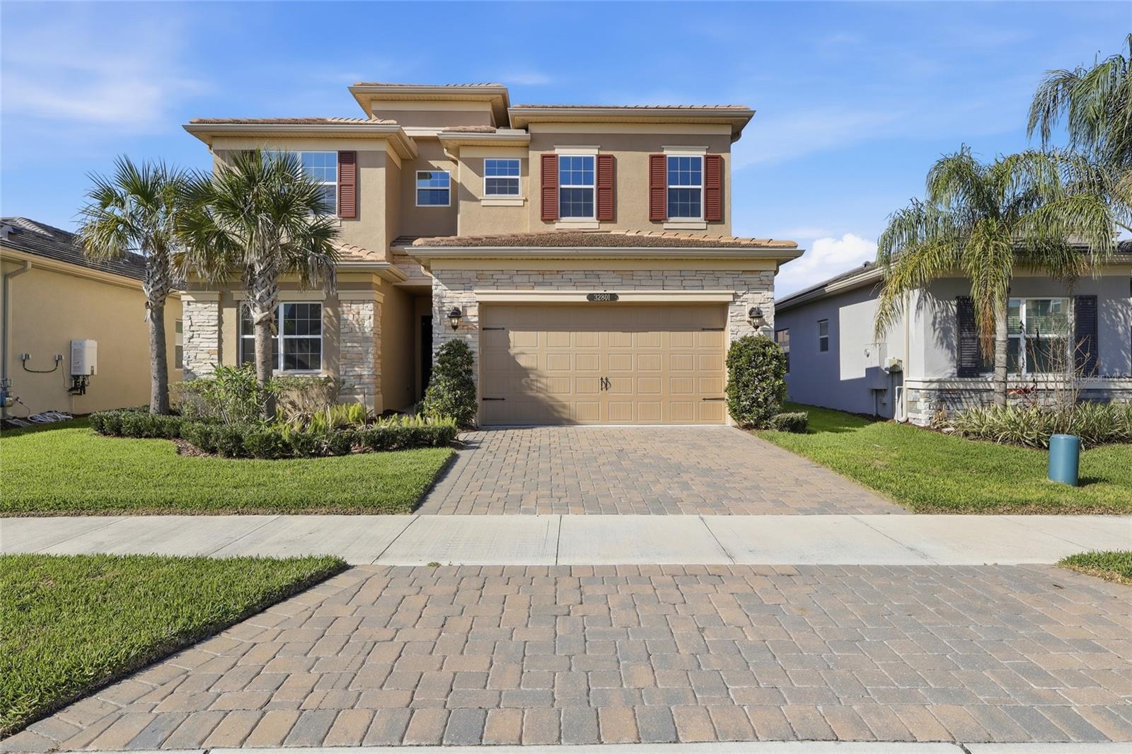 One or more photo(s) has been virtually staged. Located in the gated, CDD-free Winding Ridge community of Wesley Chapel, this spacious 5 bedroom, 5 bathroom, 3 car tandem garage residence offers a functional floor plan with multiple living areas and approximately 3300 square feet of living space designed for both everyday living and entertaining.

A grand foyer welcomes you into the home and leads to the open-concept main living area. The kitchen, dining, and family room flow seamlessly together, creating a spacious gathering space filled with natural light. The kitchen features a large center island, breakfast area, abundant cabinetry, and ample storage, while large windows throughout the home provide views of the outdoor living areas.

The flexible layout includes multiple living and dining spaces, offering versatility for a variety of lifestyles. All bedrooms are generously sized, and the home's thoughtful design provides both privacy and functionality.

Winding Ridge is a 24-hour guard-gated community offering an extensive collection of amenities, including a clubhouse with event space, fitness center, indoor basketball court, resort-style swimming pool, splash park, playground, picnic areas, tennis courts, pickleball courts, and outdoor basketball facilities. The community also hosts a variety of resident activities and events throughout the year.

Conveniently located near I-75, the property offers easy access to shopping, dining, medical facilities, and entertainment destinations including Tampa Premium Outlets, The Shops at Wiregrass, KRATE at The Grove, and other Wesley Chapel amenities.

This 5 bedroom, 5 bathroom, 3 car tandem garage home offers a desirable combination of space, community amenities, and a convenient location in one of Wesley Chapel's established gated communities. Schedule your private showing today.