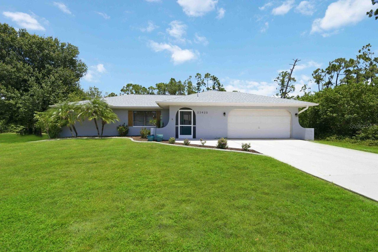 Welcome to 23420 Steeple Avenue in Port Charlotte! Nestled on a quiet dead-end street in an area of newer homes, this well-maintained 2-bedroom, 2-bath residence offers privacy, comfort, and convenience. Recent updates include a new roof, fresh exterior paint, luxury vinyl plank flooring in the bedrooms, and a beautifully screened and tiled covered lanai—perfect for enjoying Florida’s year-round sunshine.

Inside, you’ll find a bright and inviting living and dining area with sliding glass doors leading to the lanai, creating an ideal space for entertaining. The spacious primary suite features a walk-in closet and private en-suite bath, while the guest bedroom offers ample storage with a double closet. The kitchen boasts warm wood cabinetry, neutral finishes, and plenty of workspace.

Need a two-car garage with EXTRA SIDE PARKING for a BOAT, RV, or additional vehicles, and a storage shed in the backyard? Got it! Not to mention, this home is conveniently located near shopping, dining, medical facilities, and with easy access to I-75 and US-41, this home combines peaceful living with everyday convenience. Don’t miss your opportunity to make this charming Port Charlotte property your own!