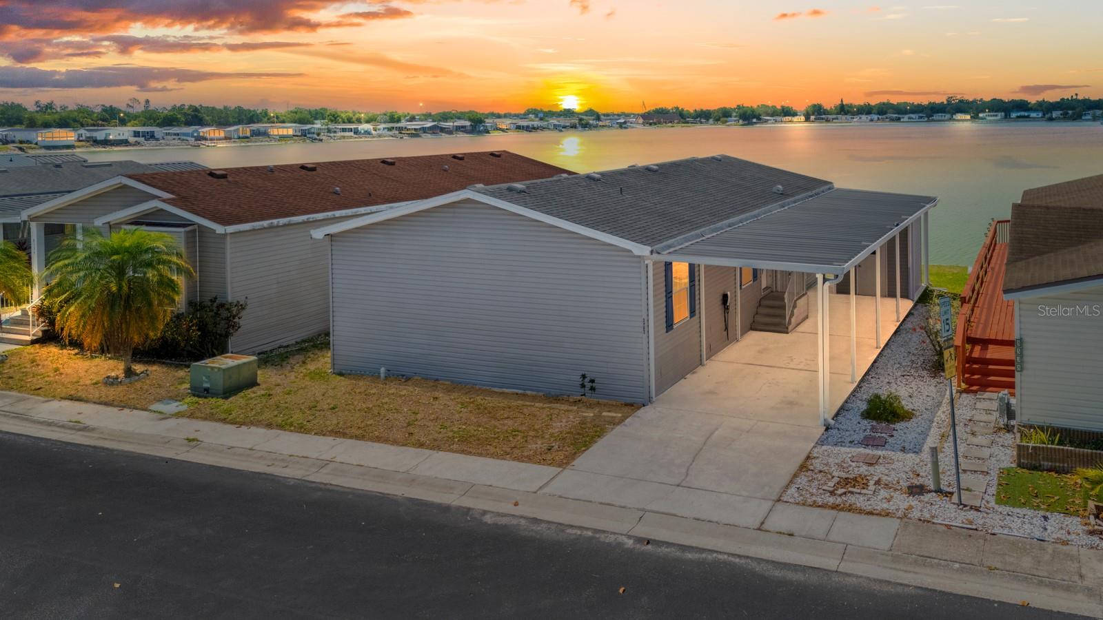 BACK ON MARKET BUYERS FINANCING FELL THROUGH. INSPECTION REPAIRS AND APPRAISAL ALREADY COMPLETE! Welcome to this beautifully updated waterfront home located in the highly sought-after gated community of Lake Fantasia, in the heart of Riverview. This immaculate 2007 manufactured home offers 2 bedrooms, 2 bathrooms, and 1,220 heated square feet with 1,938 gross square feet of thoughtfully improved living space, all perfectly positioned on a large lake with peaceful water views.

From the moment you arrive, you will appreciate the charming curb appeal with freshly painted shutters and siding, vinyl exterior, covered carport, electric vehicle charger, and separate locked storage area complete with shelving. Inside, this home has been meticulously cleaned, updated, and professionally staged, offering buyers a true move-in ready experience. The interior has been freshly painted throughout in modern Agreeable Gray tones and features brand-new blinds, updated lighting fixtures, new smoke detectors, and a bright welcoming atmosphere.

The spacious kitchen has been beautifully refreshed with brand-new stainless steel appliances including a refrigerator, range, microwave, and dishwasher, while the washer and dryer are also included for added convenience. The primary suite offers dual closets and an upgraded en-suite bathroom featuring elegant gray tile, a beautiful vanity, and a stunning walk-in shower. The secondary bathroom has also been tastefully updated and includes a tub/shower combination with modern finishes.

One of the most exceptional features of this home is the serene screened-in back porch, which has been freshly stained and re-screened, creating the perfect place to enjoy your morning coffee while overlooking the tranquil lake, feeding the fish, and watching the birds. Residents can enjoy non-motorized lake activities such as kayaking, paddleboarding, and canoeing, making this property a rare waterfront gem.


With a low HOA of just $149 per month, residents enjoy access to community amenities including a gated entrance, speed bumps for added safety, a community pool, community center, and golf cart-friendly streets. Centrally located near shopping, dining, entertainment, and major interstates, this property offers convenience, lifestyle, and incredible value.

Previously reduced in price before renovations were completed, this home is now being offered at $209,900 with extensive upgrades already completed, allowing buyers to benefit from the seller’s investment while securing an exceptional waterfront property at an outstanding value. This beautifully maintained home truly offers affordable Florida living at its finest. Schedule your private showing today before this incredible opportunity is gone.