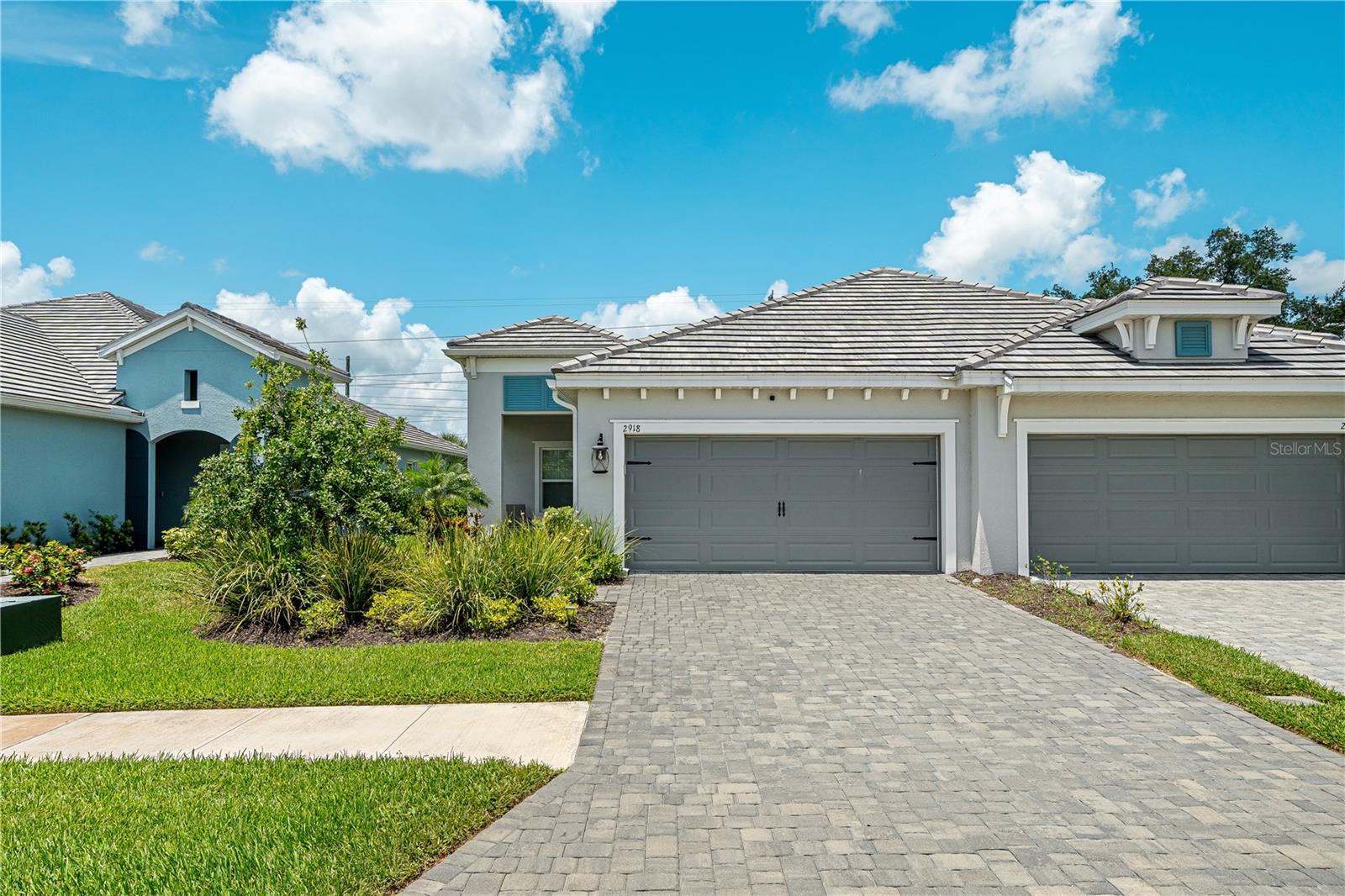 Welcome to Windward at Lakewood Ranch, a gated resort-style community in one of Sarasota’s most desirable locations. Built in 2023, this like-new home offers the benefits of newer construction without the wait. Located on a quiet cul-de-sac, the home features beautiful curb appeal, a paved driveway, screened front porch, and over 1,500 square feet of thoughtfully designed living space. 
Inside, you’ll find 2 bedrooms, 2 bathrooms, a 2-car garage, and a versatile den with french doors, perfect for an office or guest space.
Just minutes from Waterside Place, top-rated schools, I-75, UTC, downtown Sarasota, dining, shopping, and Gulf Coast beaches, this home is ideal for full-time or part-time Florida living.