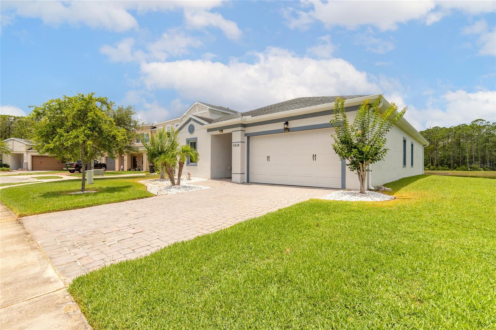 Welcome to this exceptional 4/2 lakefront home nestled on an oversized cul-de-sac lot in one of Port Orange's most desirable communities. Built in 2018 with solid concrete block construction, this pristine residence offers the perfect combination of modern design, quality craftsmanship, and an unbeatable Florida lifestyle. Beautiful hard-surface flooring flows throughout the home, complementing the bright, open-concept floor plan designed for both everyday living and effortless entertaining. The gourmet kitchen serves as the heart of the home, featuring stunning stone countertops, solid wood cabinetry, a large center island, and abundant workspace--perfect for family gatherings, holiday celebrations, and hosting friends. The spacious living and dining areas seamlessly connect to the screened lanai, where picturesque lake views create a tranquil backdrop for morning coffee, outdoor dining, or relaxing after a long day. Mature landscaping and the oversized homesite provide exceptional curb appeal, privacy, and plenty of room to enjoy the outdoors. Located within a highly sought-after Port Orange neighborhood with access to a community pool and zoned for A-rated schools, this home offers convenience at every turn. Enjoy easy access to shopping, dining, healthcare, and major roadways, while being just minutes from Daytona Beach--home to the "World's Most Famous Beach." Commuters and professionals will appreciate the close proximity to Embry-Riddle Aeronautical University and Palmer College of Chiropractic. Offering newer construction, breathtaking waterfront views, premium finishes, and an outstanding location, this move-in-ready home is a rare opportunity to experience the very best of Port Orange living. All information intended to be accurate, but should be verified.